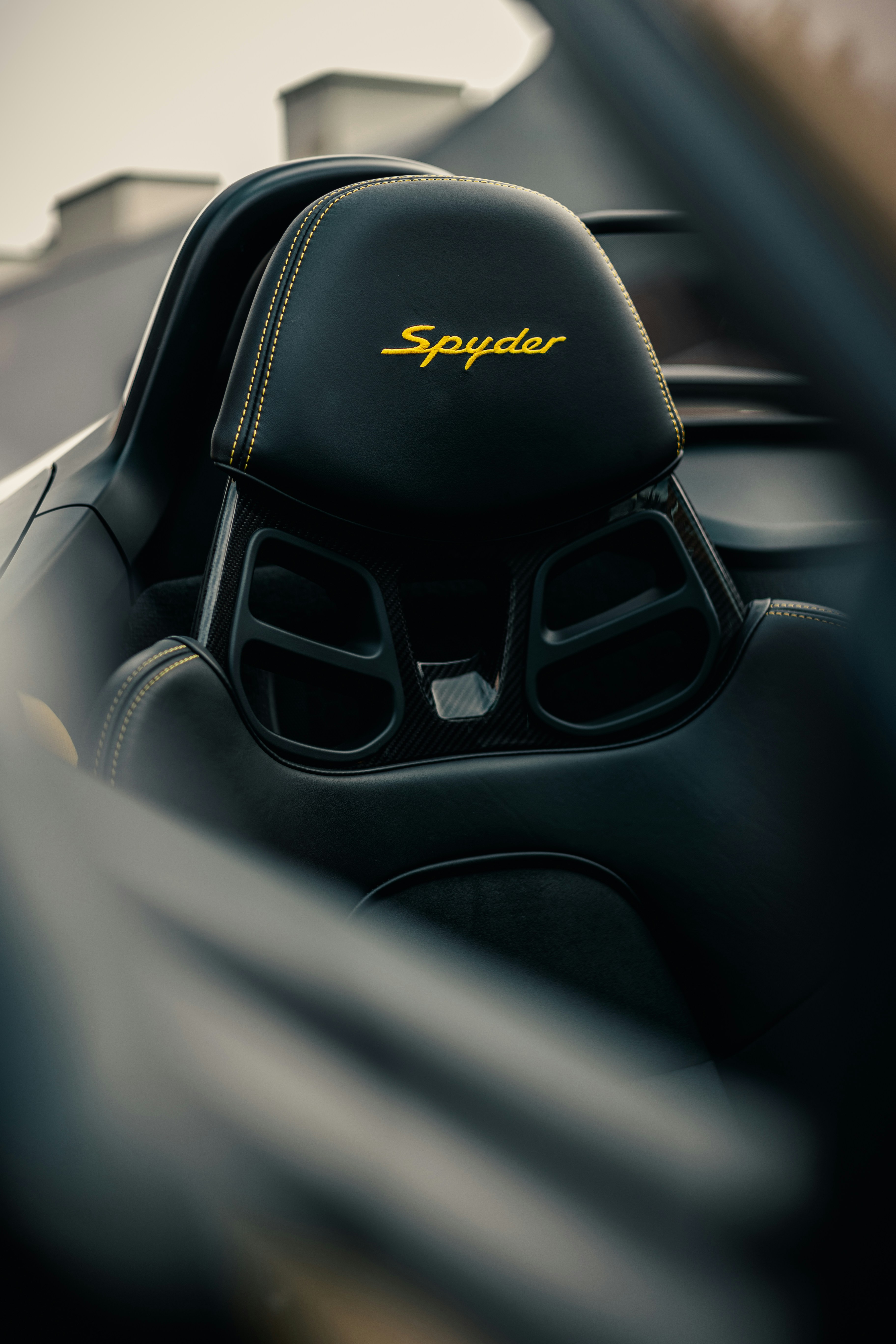 A close up of a car dashboard with a steering wheel