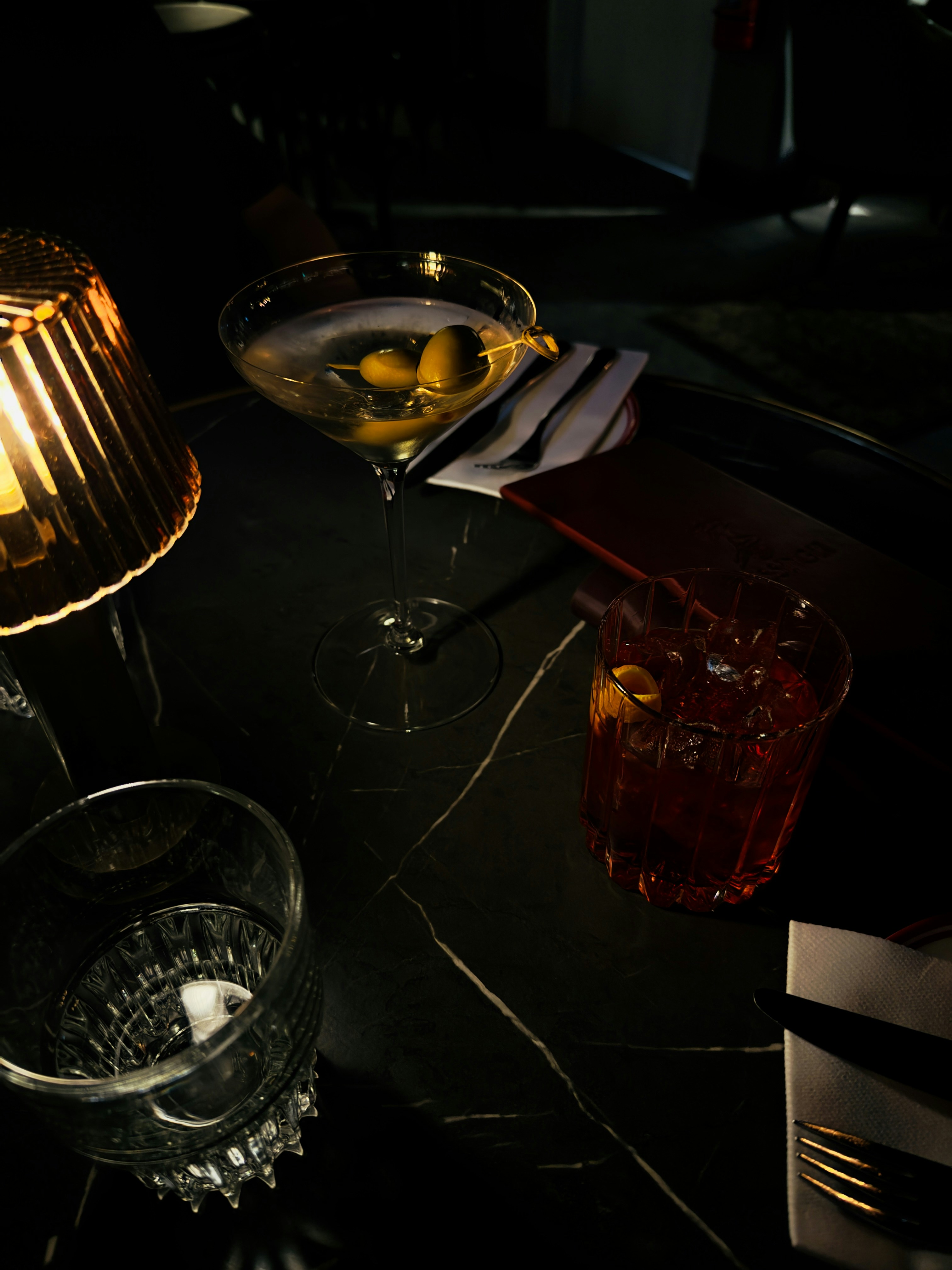 A table topped with two glasses filled with liquid