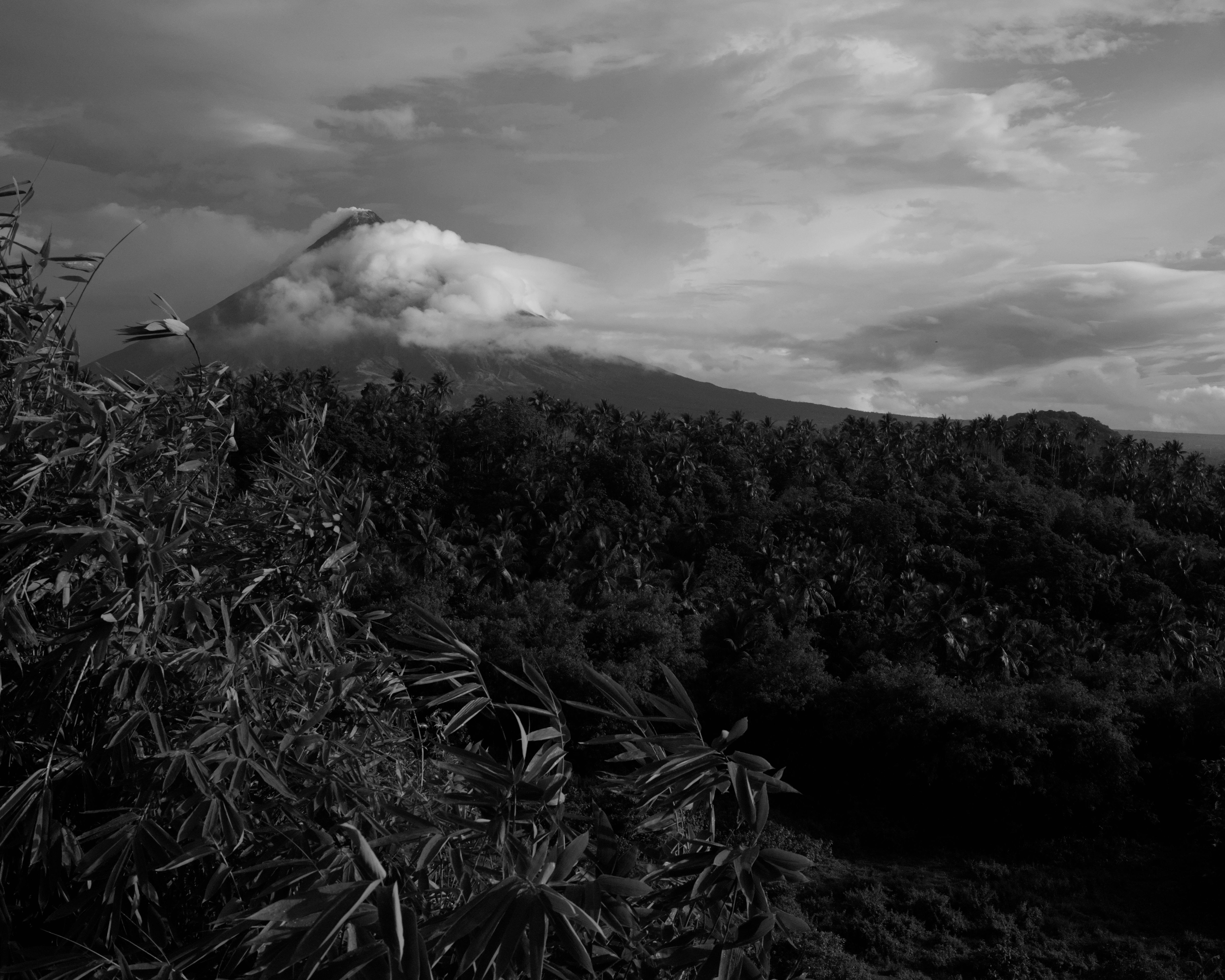 A black and white photo of a mountain