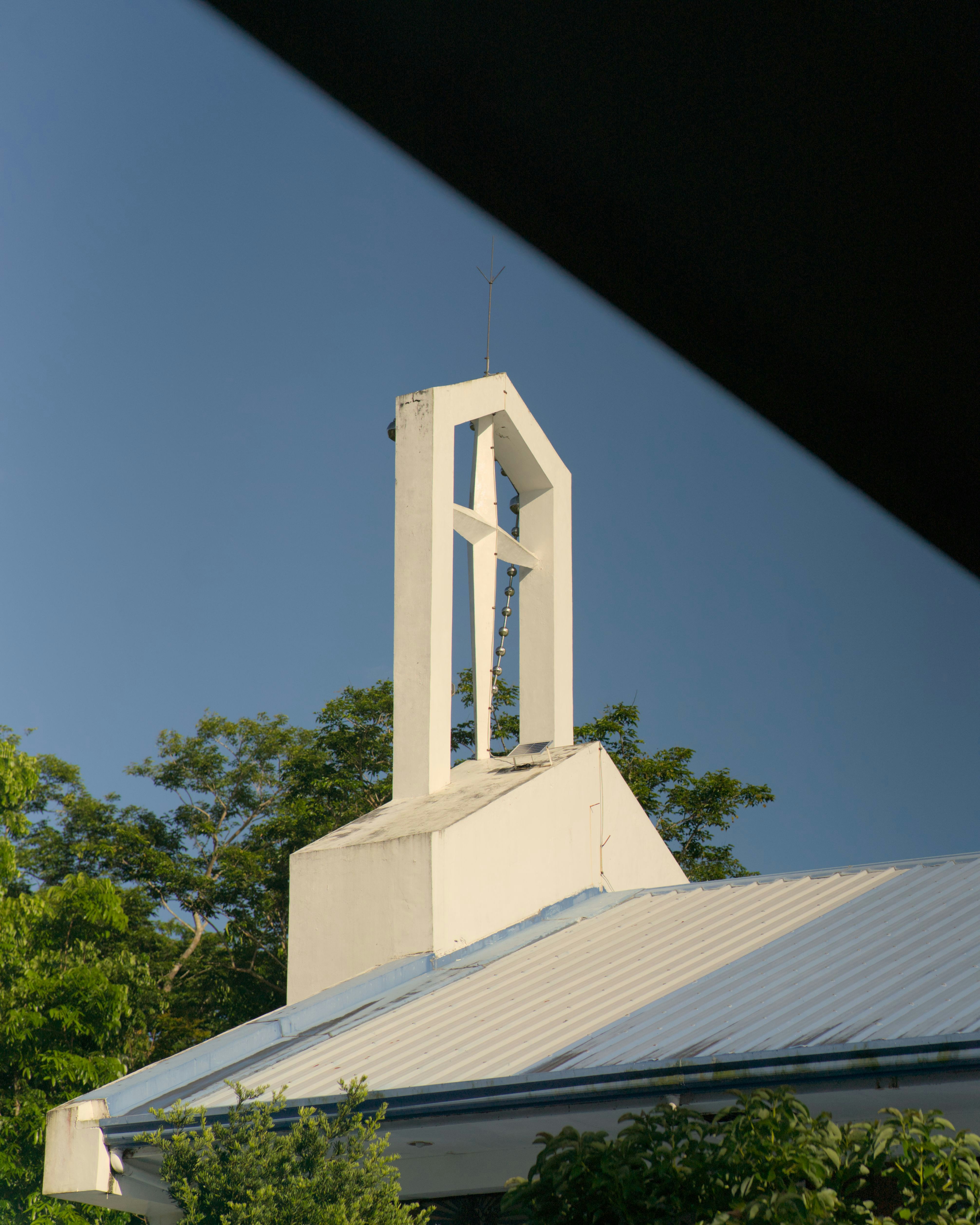 A church steeple with a clock on it
