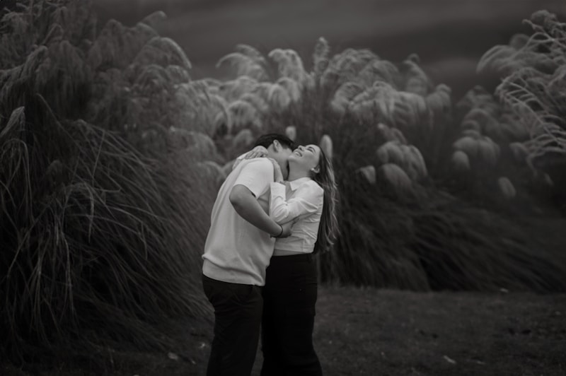 Loving couple enjoying green field