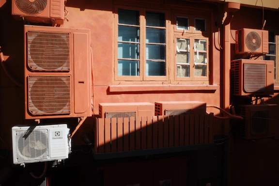A building that has a bunch of air conditioners on it