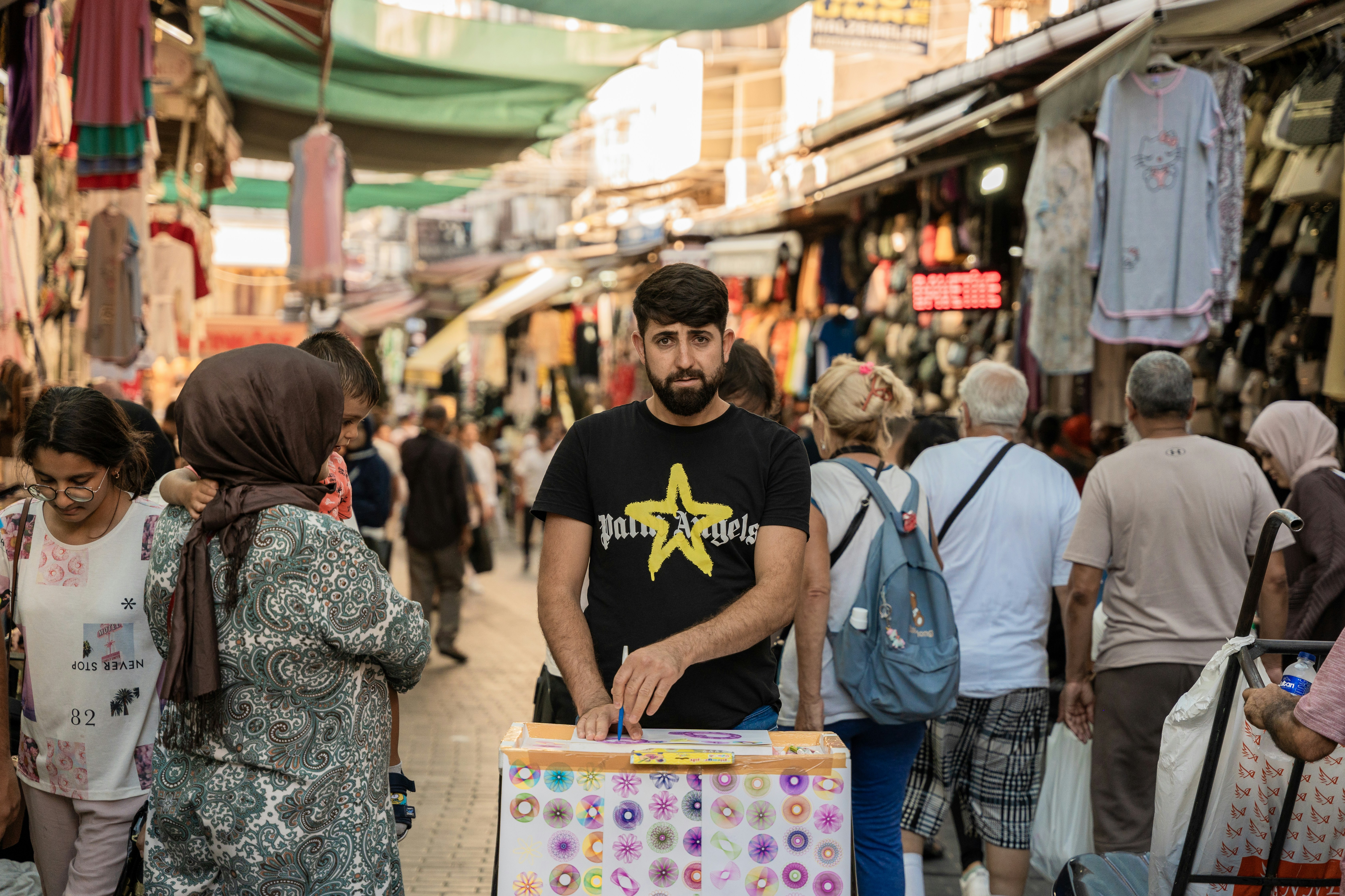 A man standing in the middle of a crowded street