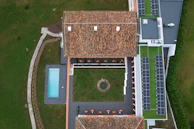 An aerial view of a house with a swimming pool
