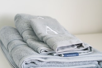 A stack of folded towels sitting on top of a table