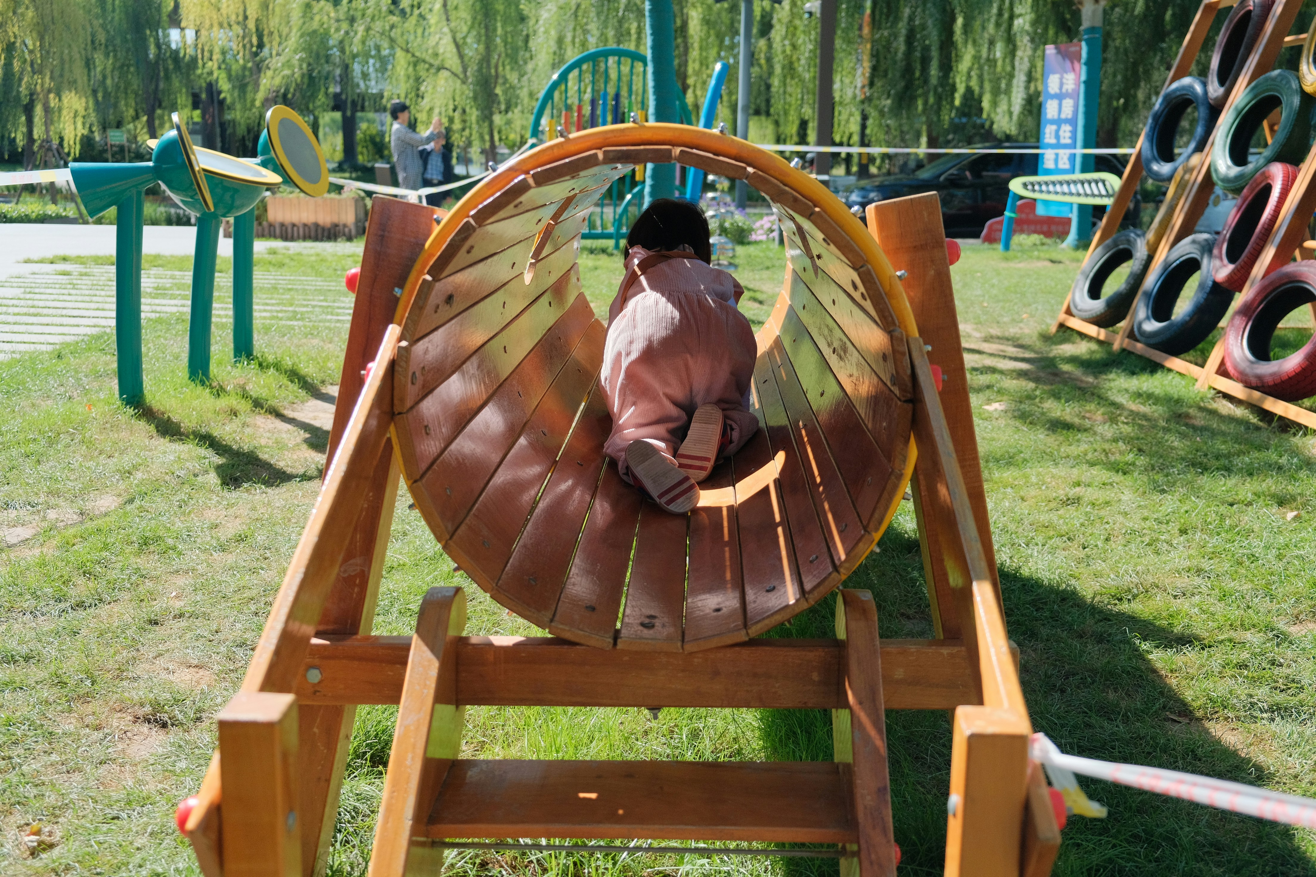 A man sitting in a wheel chair in a park