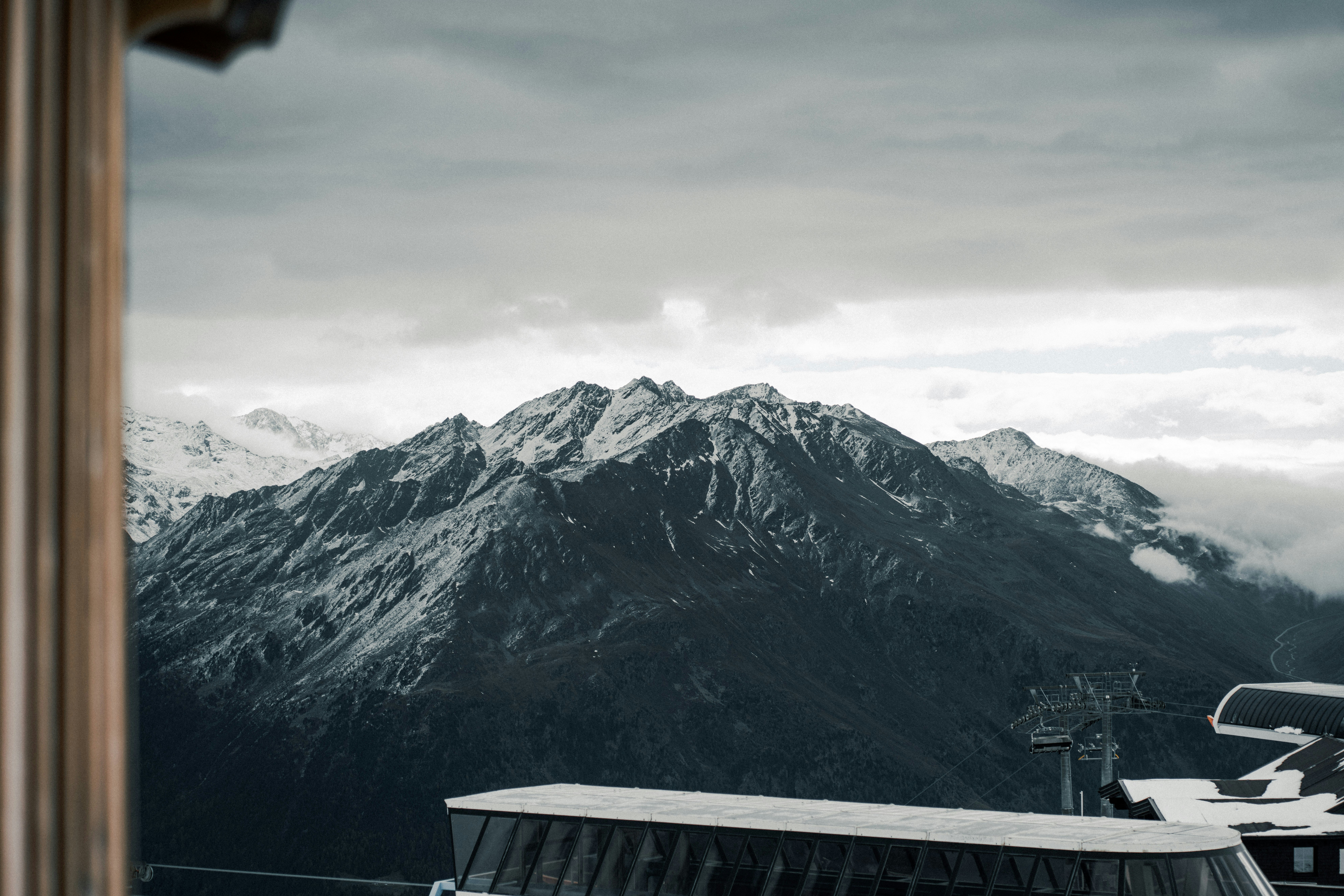 A view of a snowy mountain range from a window