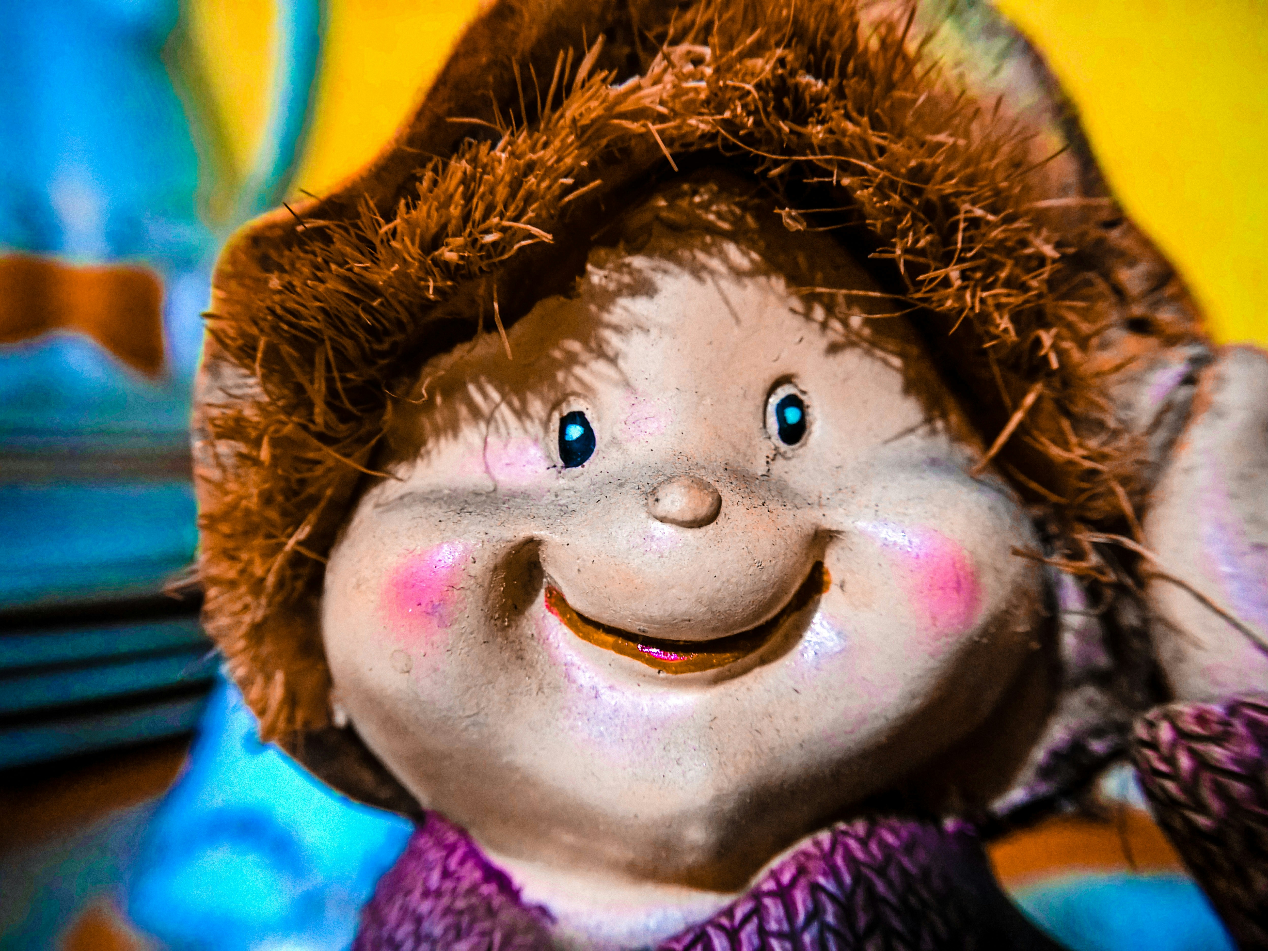 A close up of a stuffed animal wearing a hat