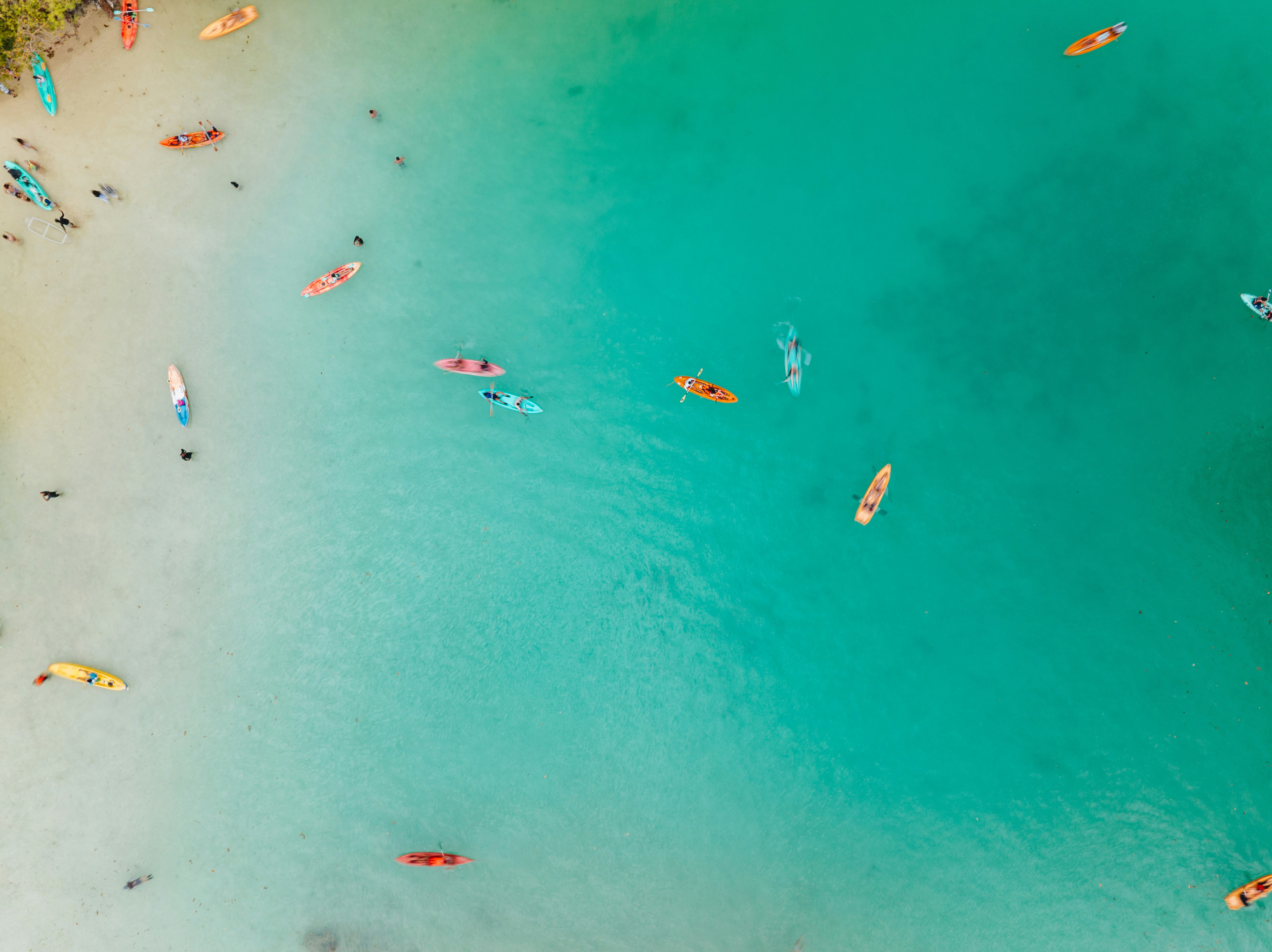 An aerial view of a beach with a lot of people