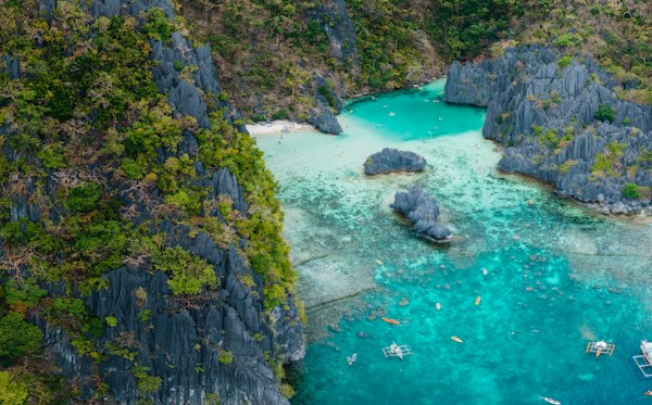 An aerial view of a lagoon surrounded by mountains — Palawan, Philippines