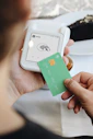 A person holding a credit card in their hand