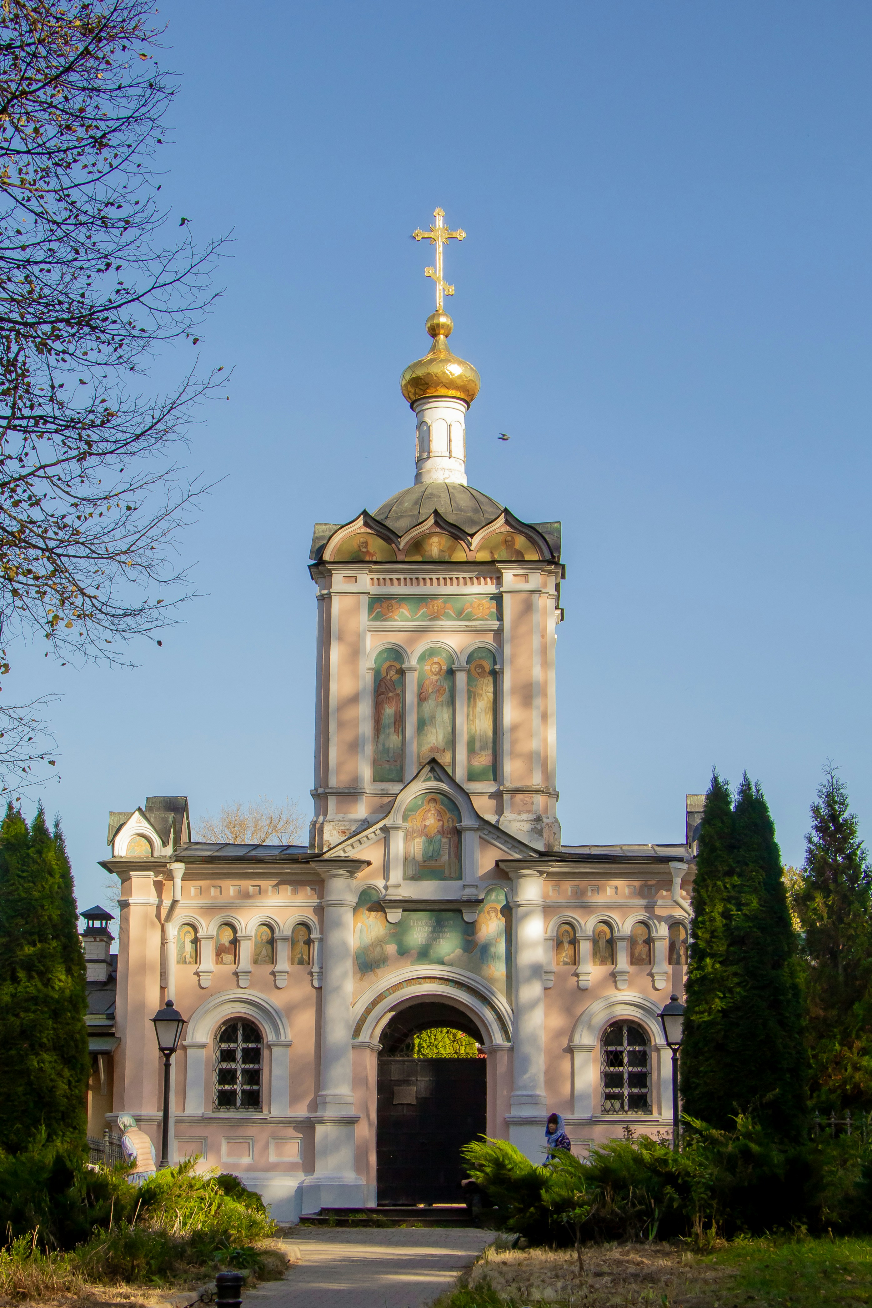 A church with a golden cross on top of it