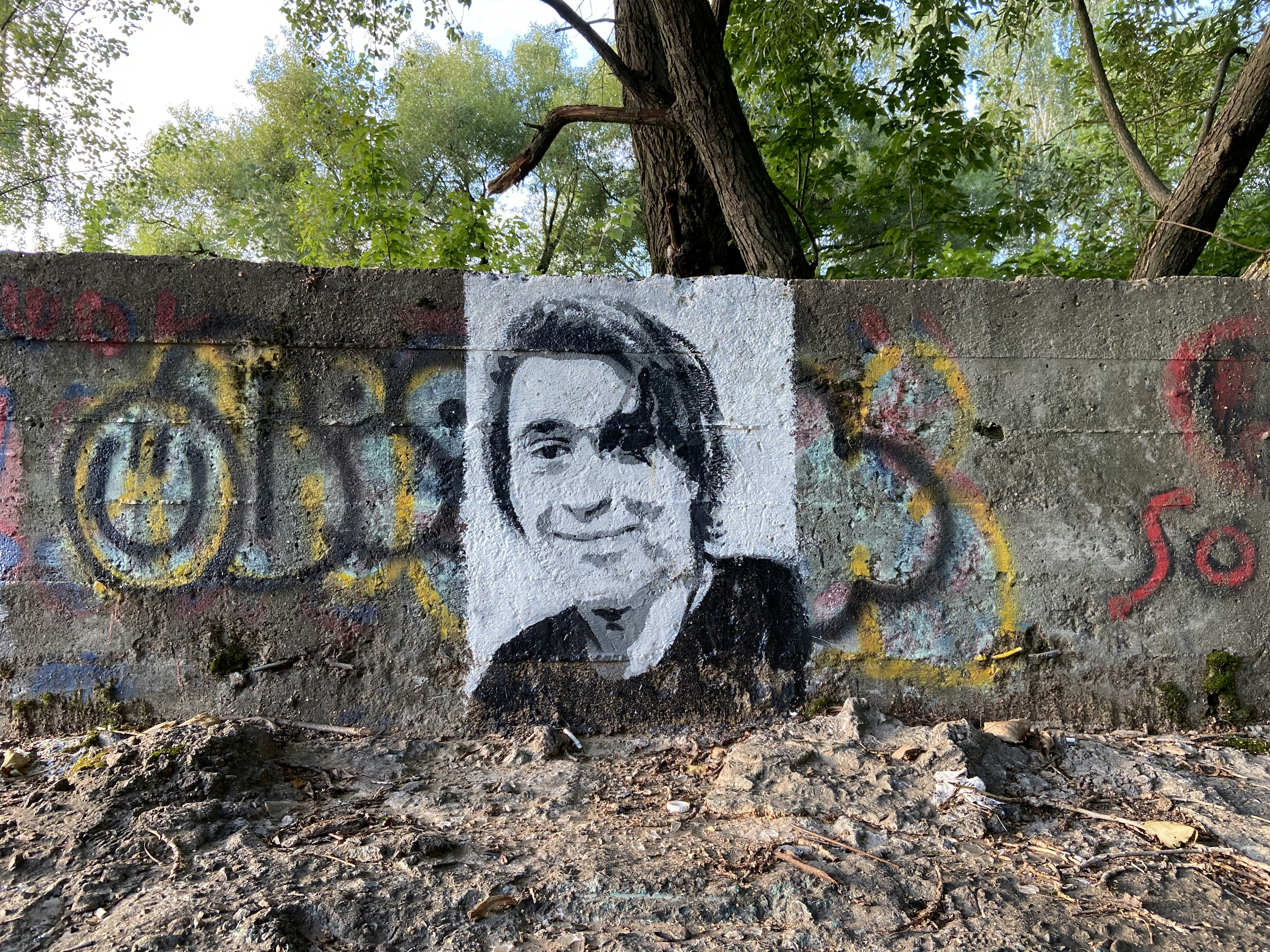 A wall with a picture of a man on it