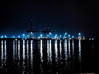 A large body of water filled with lots of lights