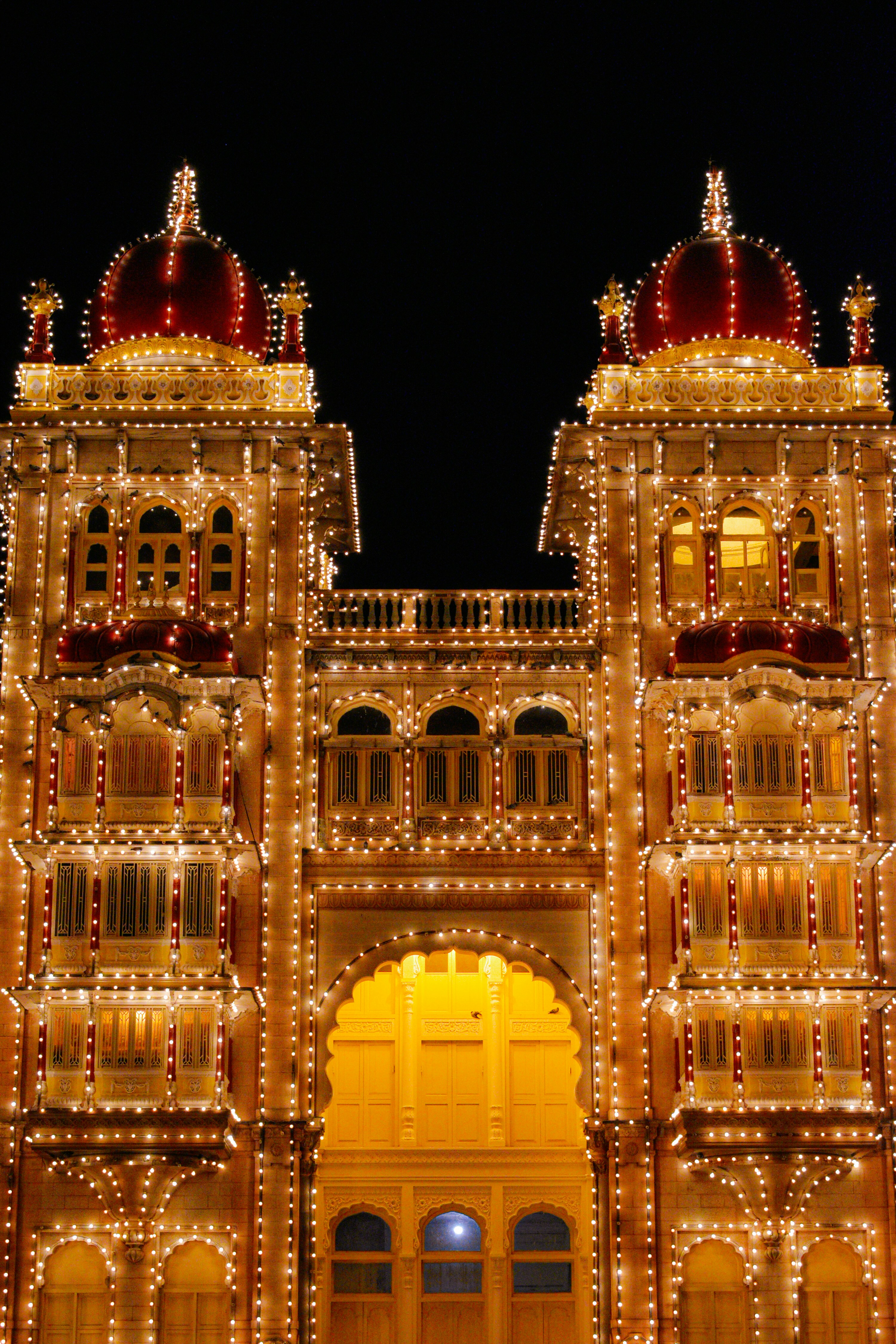 A large building that has lights all over it