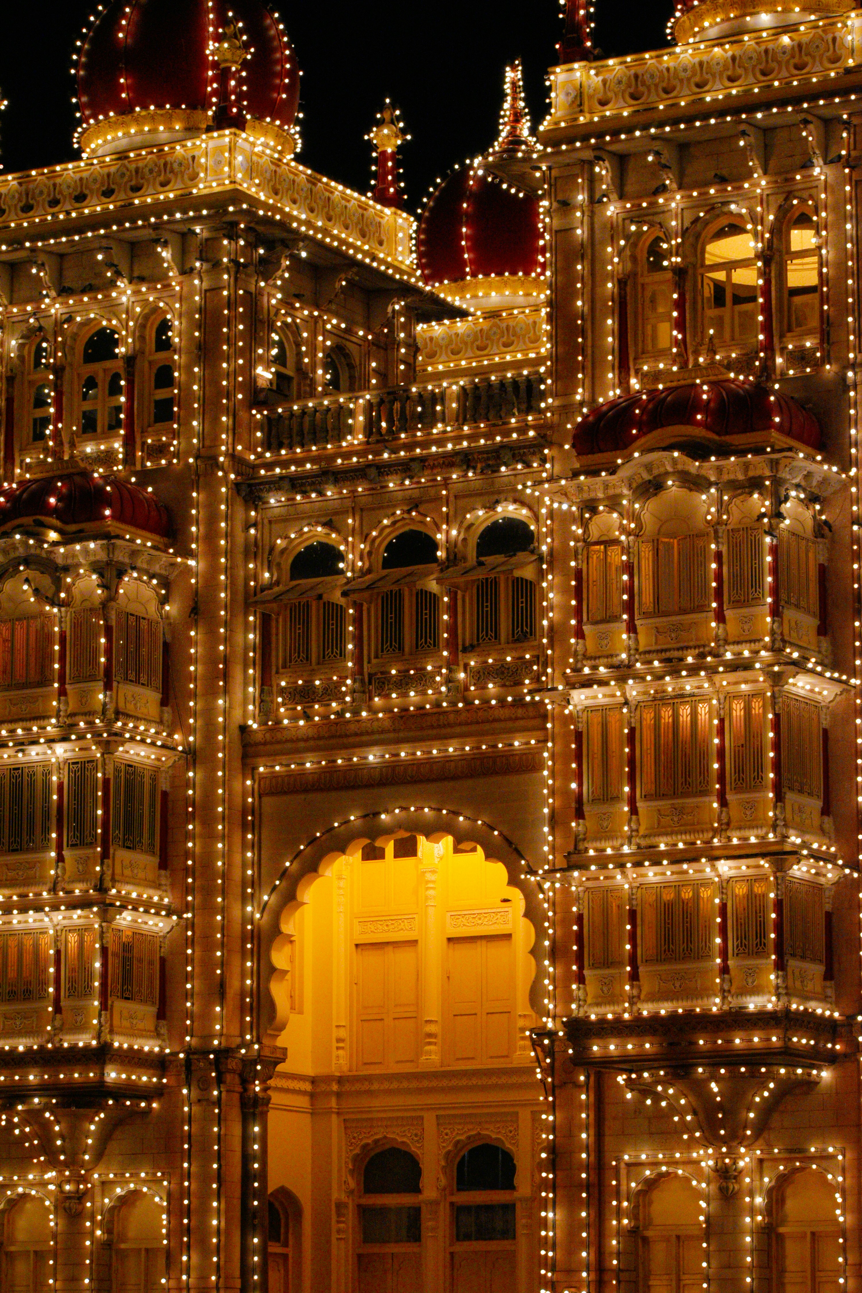 A large building with lights all over it