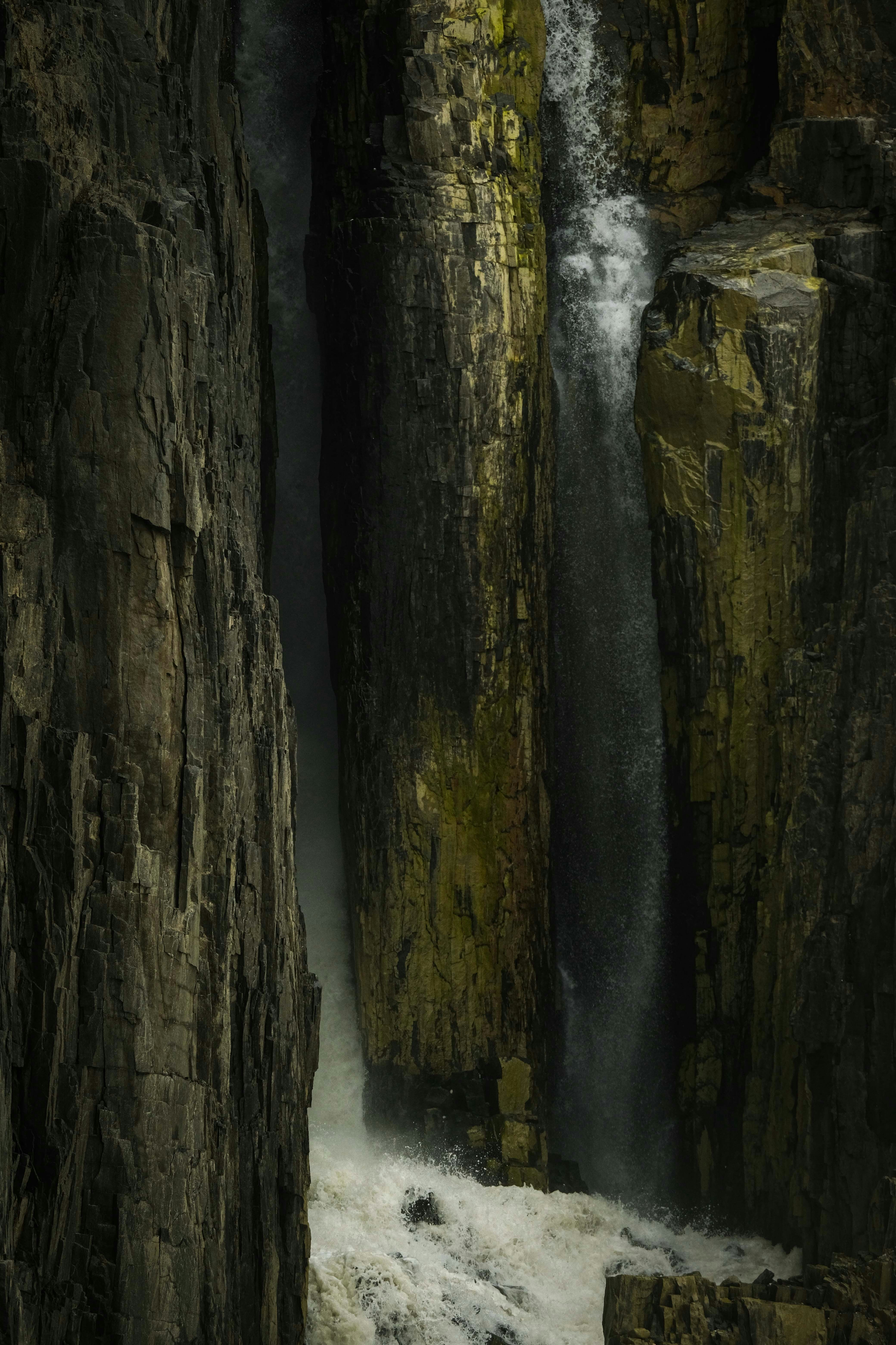 A waterfall in the middle of some rocks