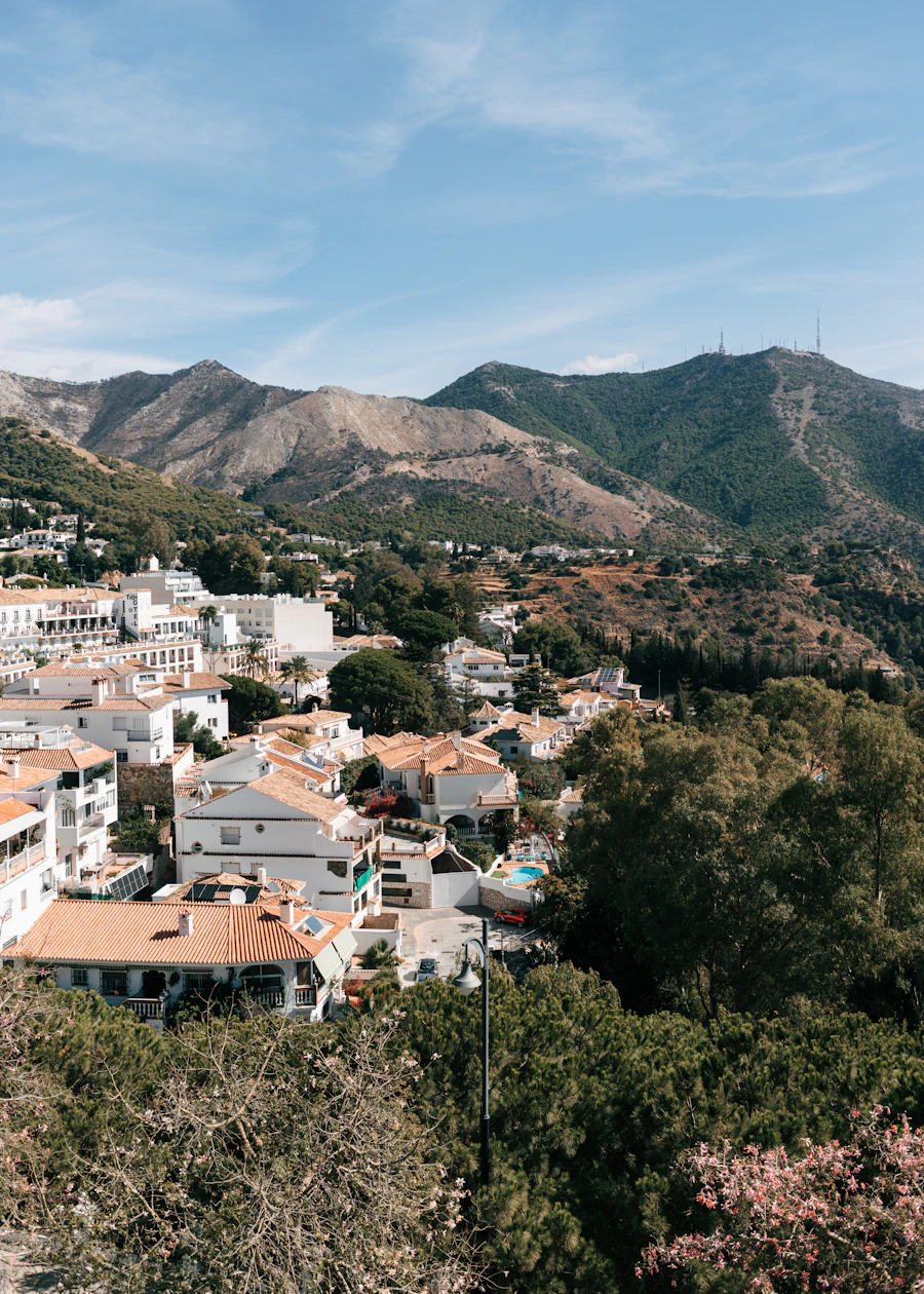 The white village of Mijas Pueblo with the mountains behind