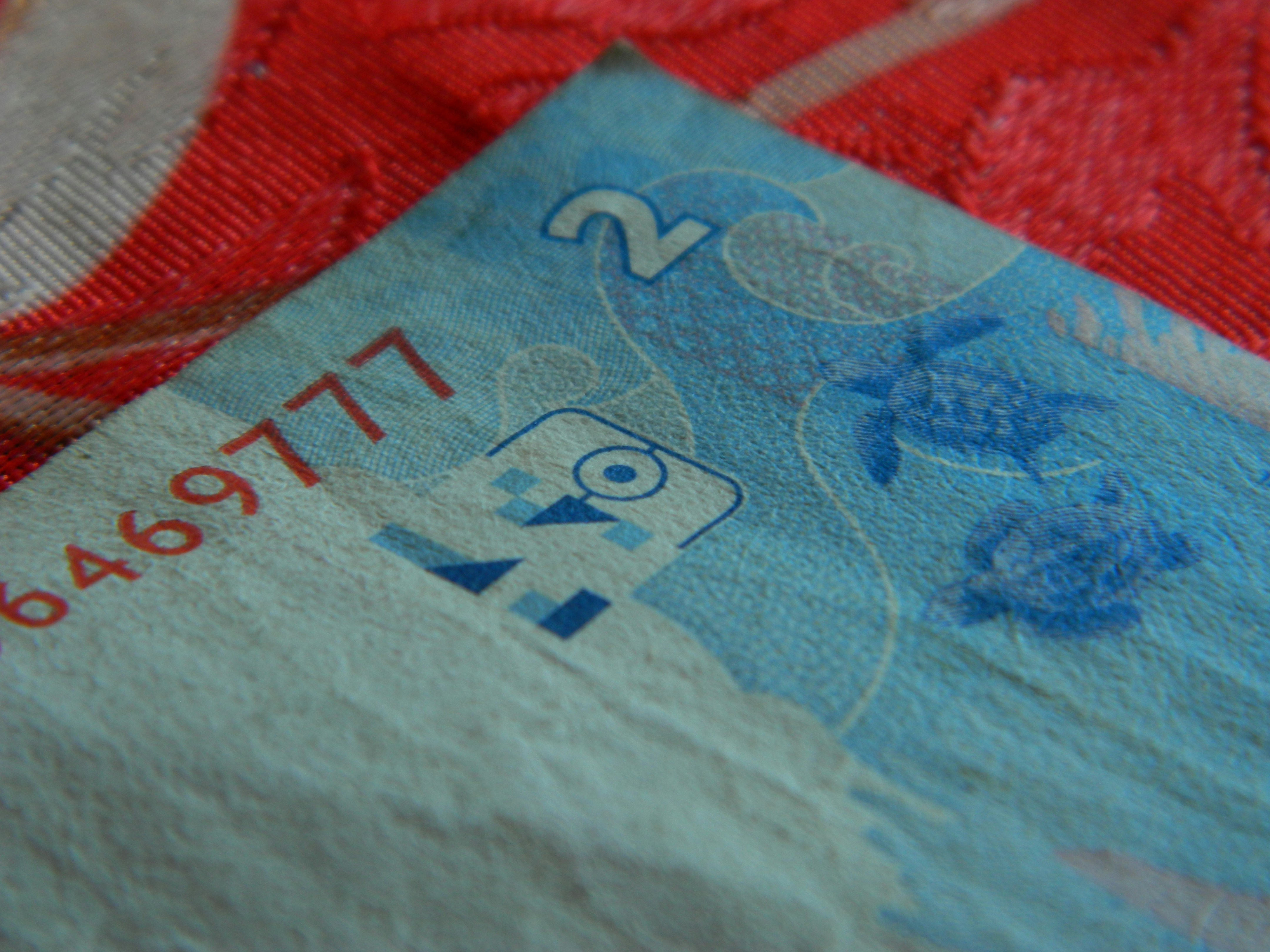 A close up of a red and blue piece of paper