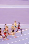 A group of people running on a track