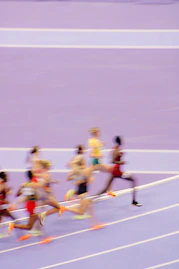 A group of people running on a track