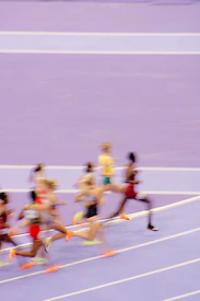 A group of people running on a track