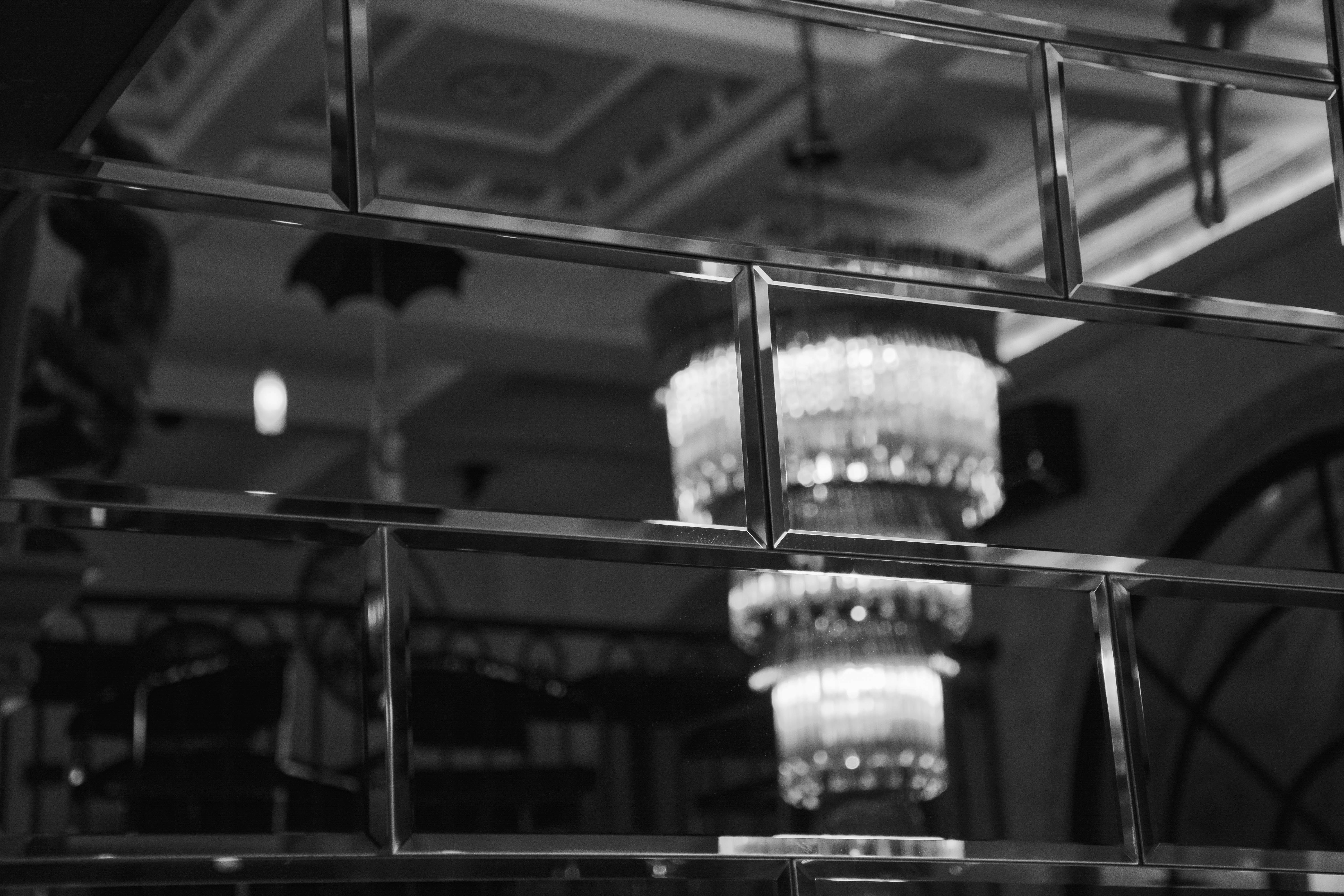 Decorative bevelled edge mirror in hotel lobby lounge area