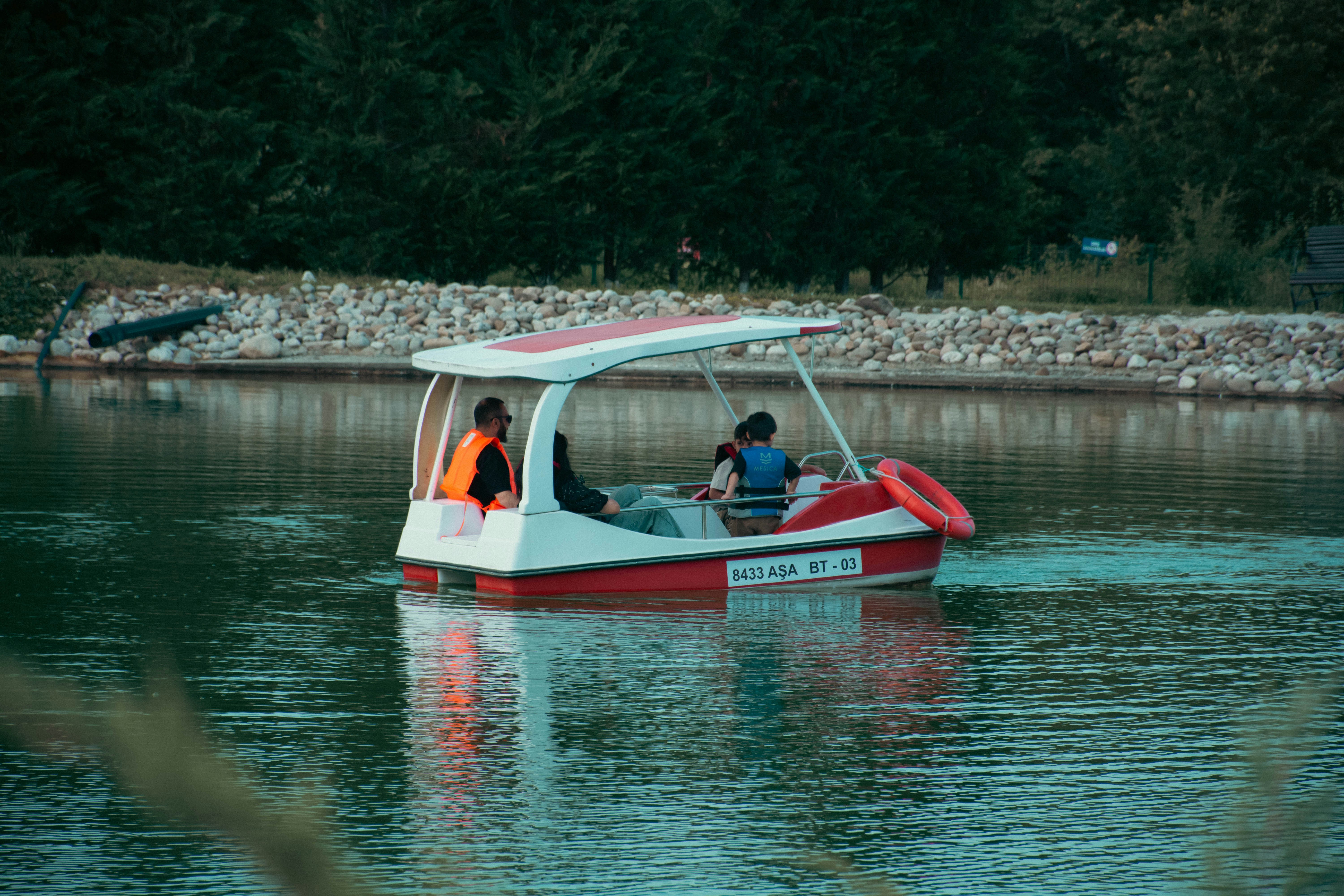 A group of people riding in a boat on a lake