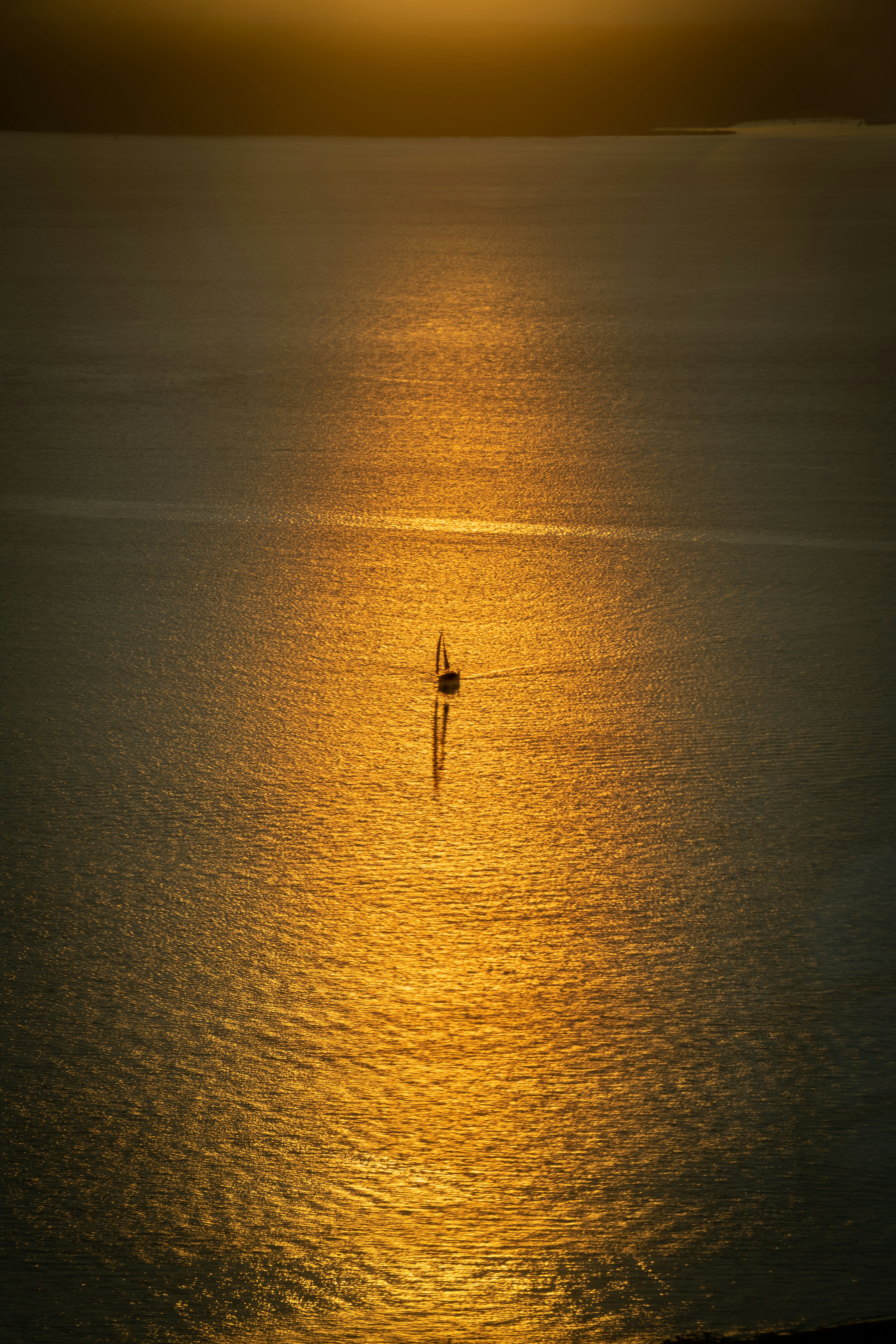 Oil rig at dramatic sunset