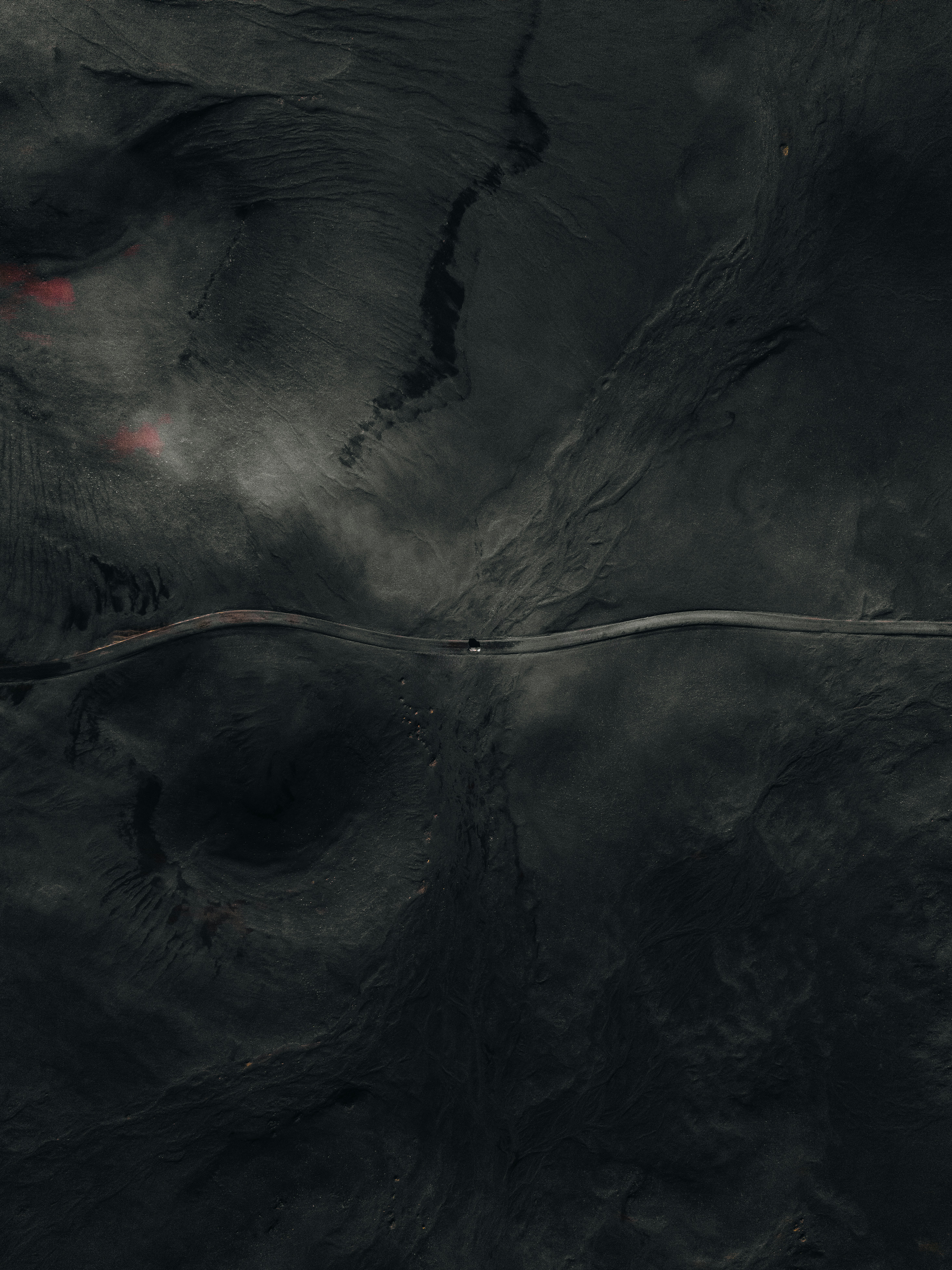 A satellite image of a red fire hydrant in the middle of the ocean