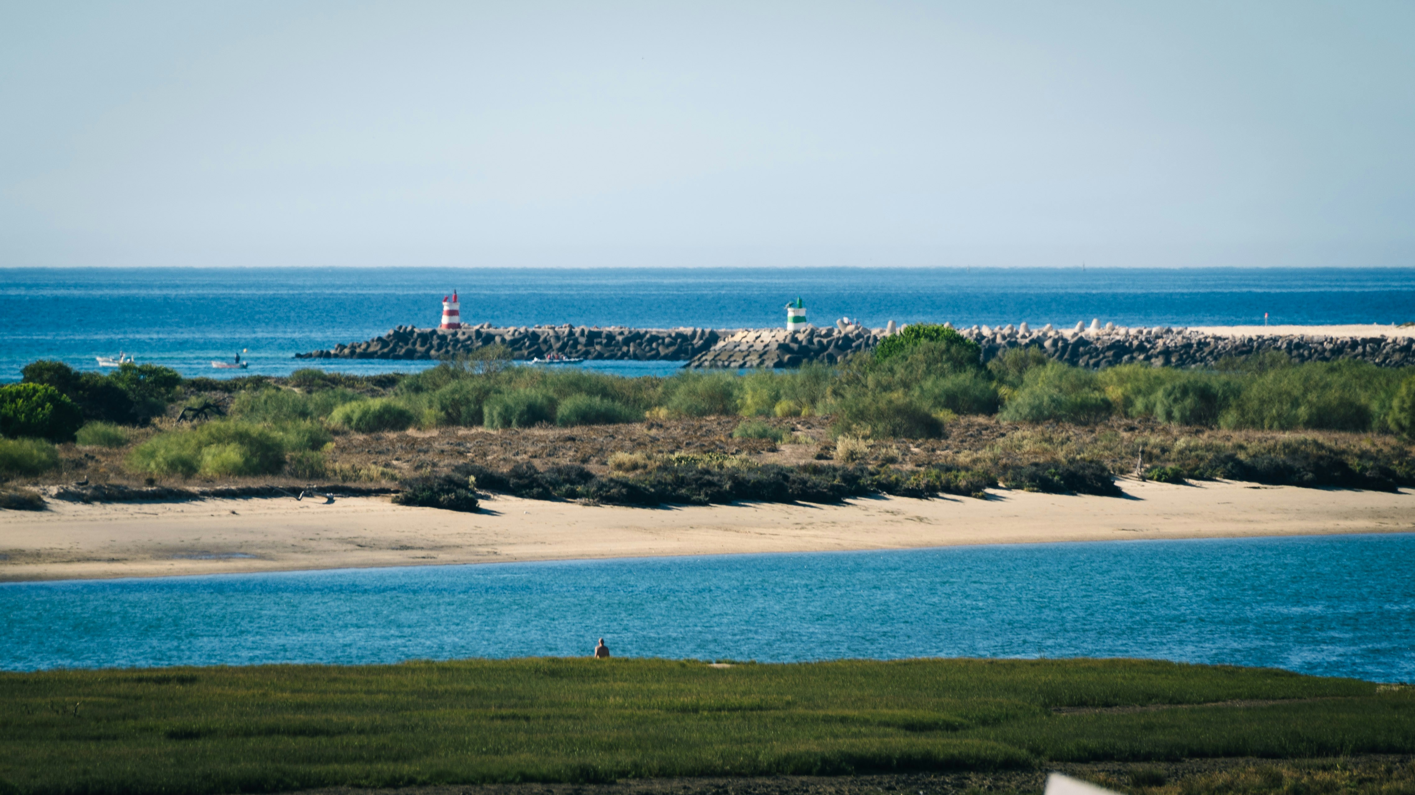 A body of water with a small island in the background