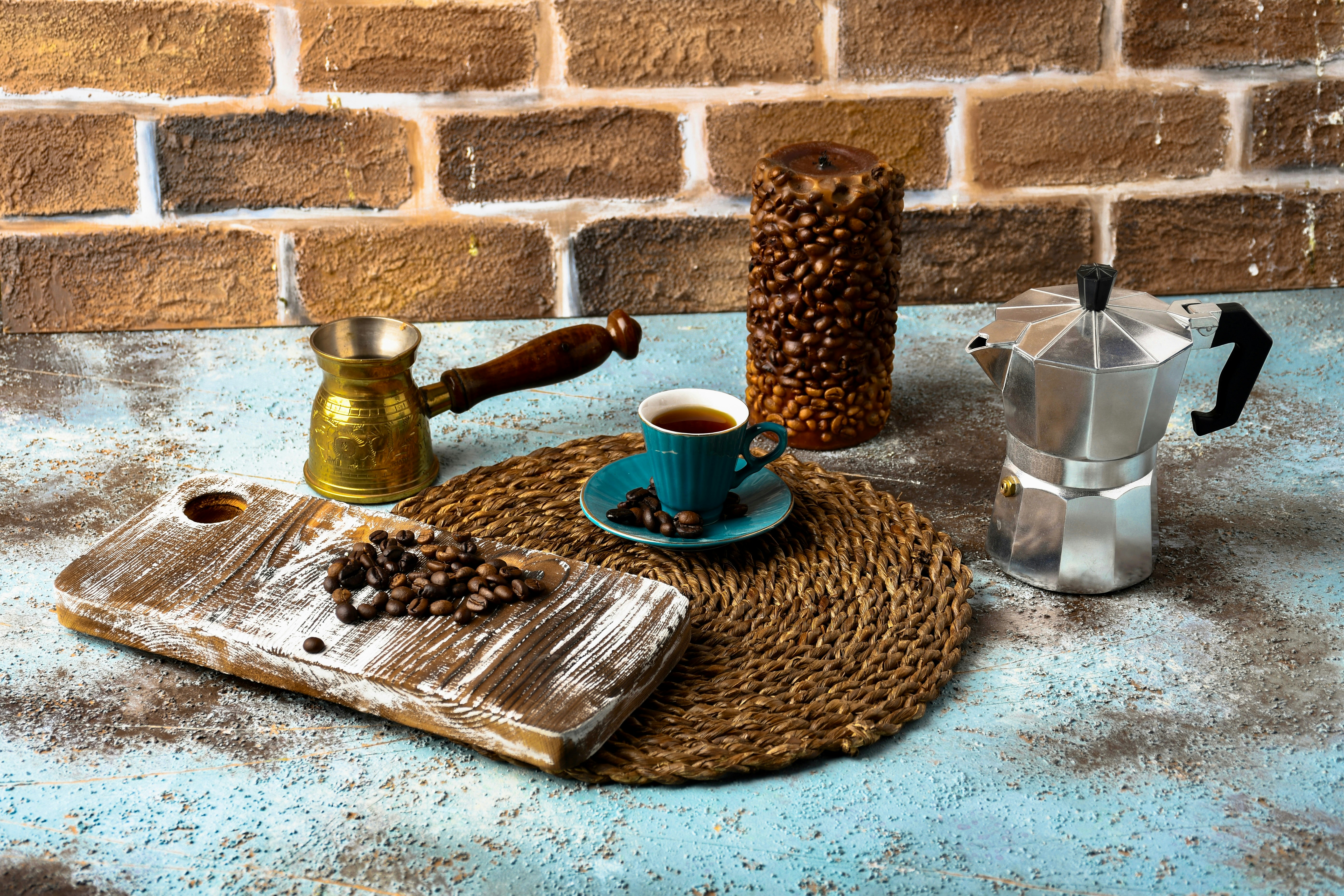A blue table topped with a cup of coffee