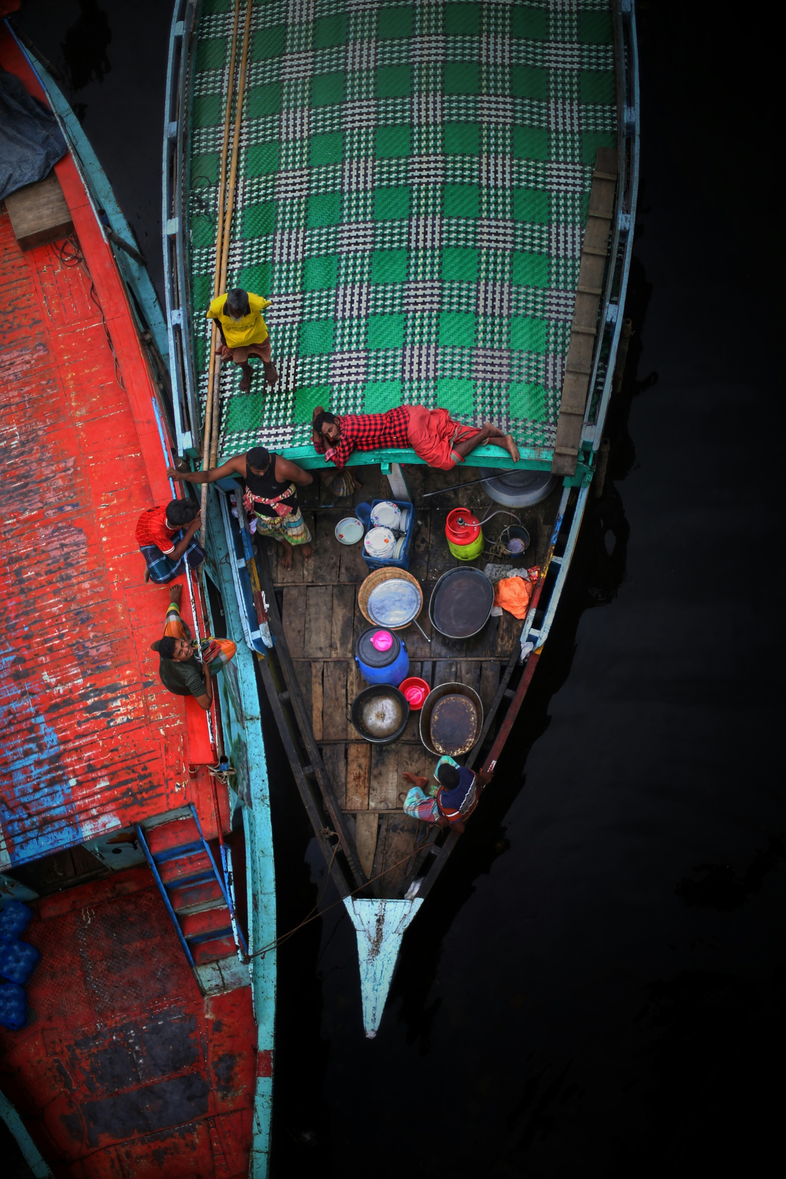 A couple of boats sitting next to each other
