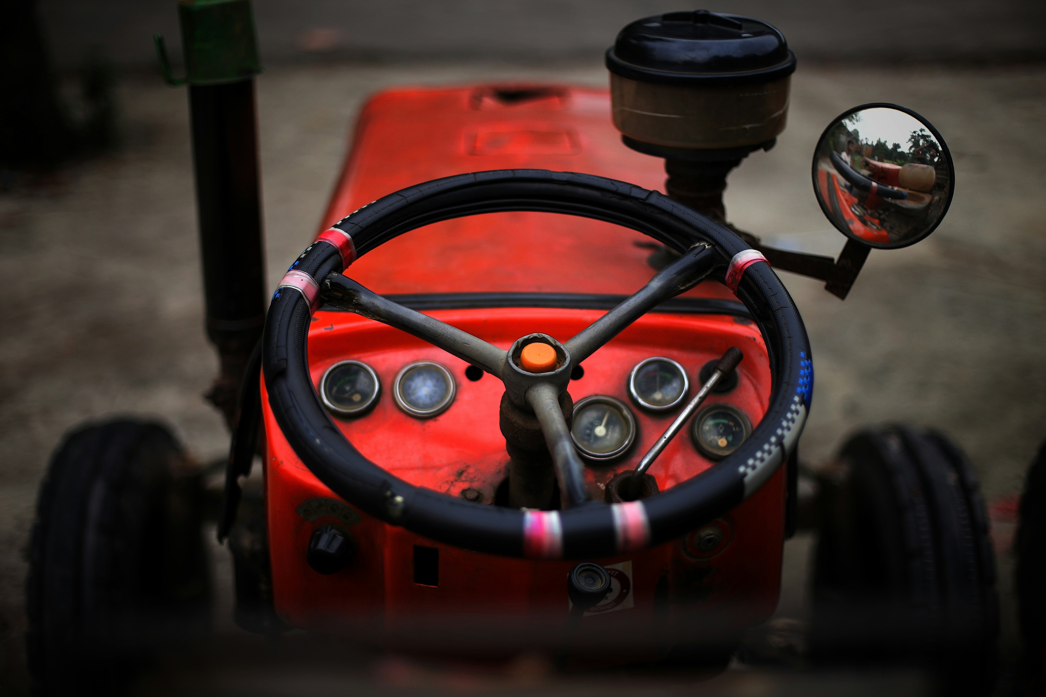 A close up of a steering wheel on a tractor