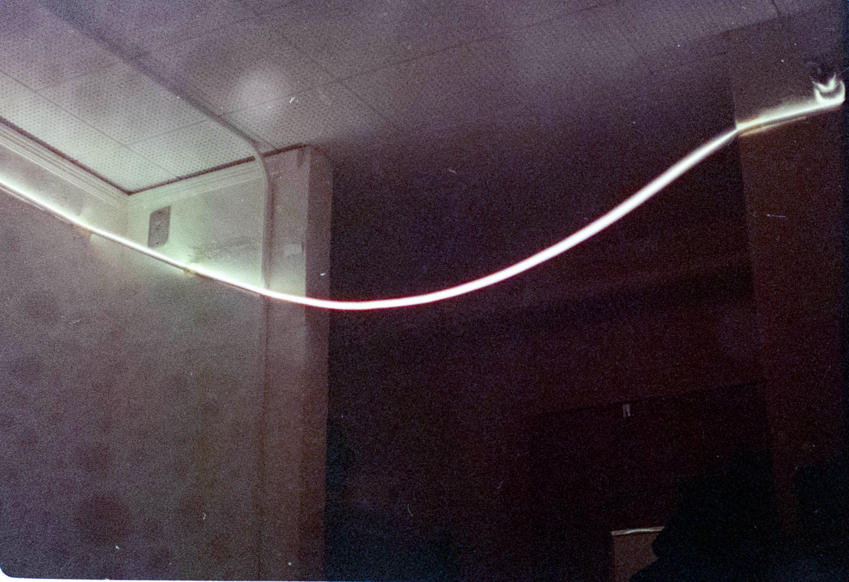 A white line curves across a dark background.