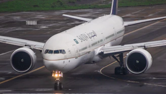 A large jetliner sitting on top of an airport tarmac