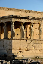 A group of statues on the side of a building