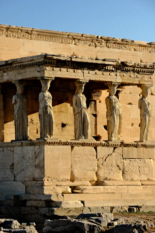 A group of statues on the side of a building