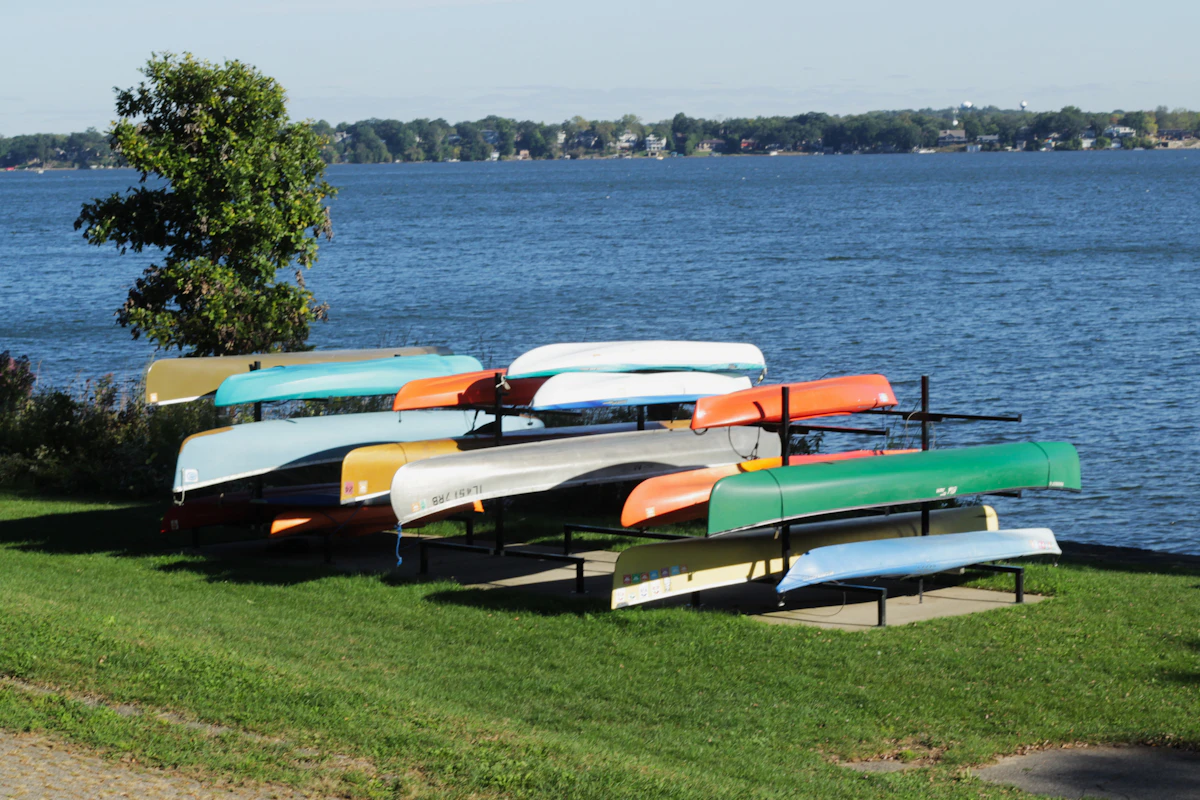 Colorful small boats on racks beside the lake at BB Clarke Beach in Madison