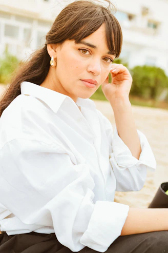 A woman sitting on the ground with a laptop