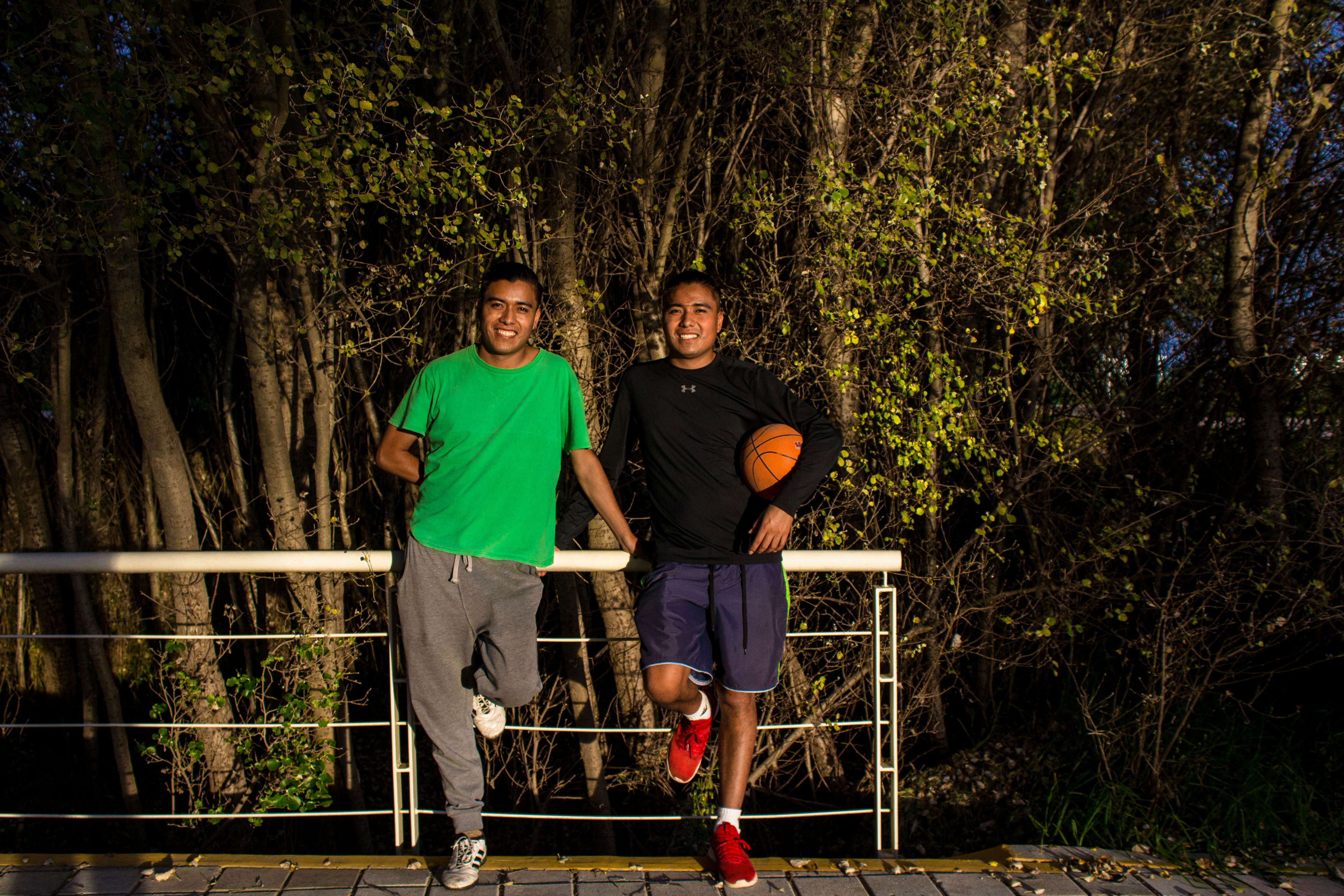 A couple of men standing next to each other