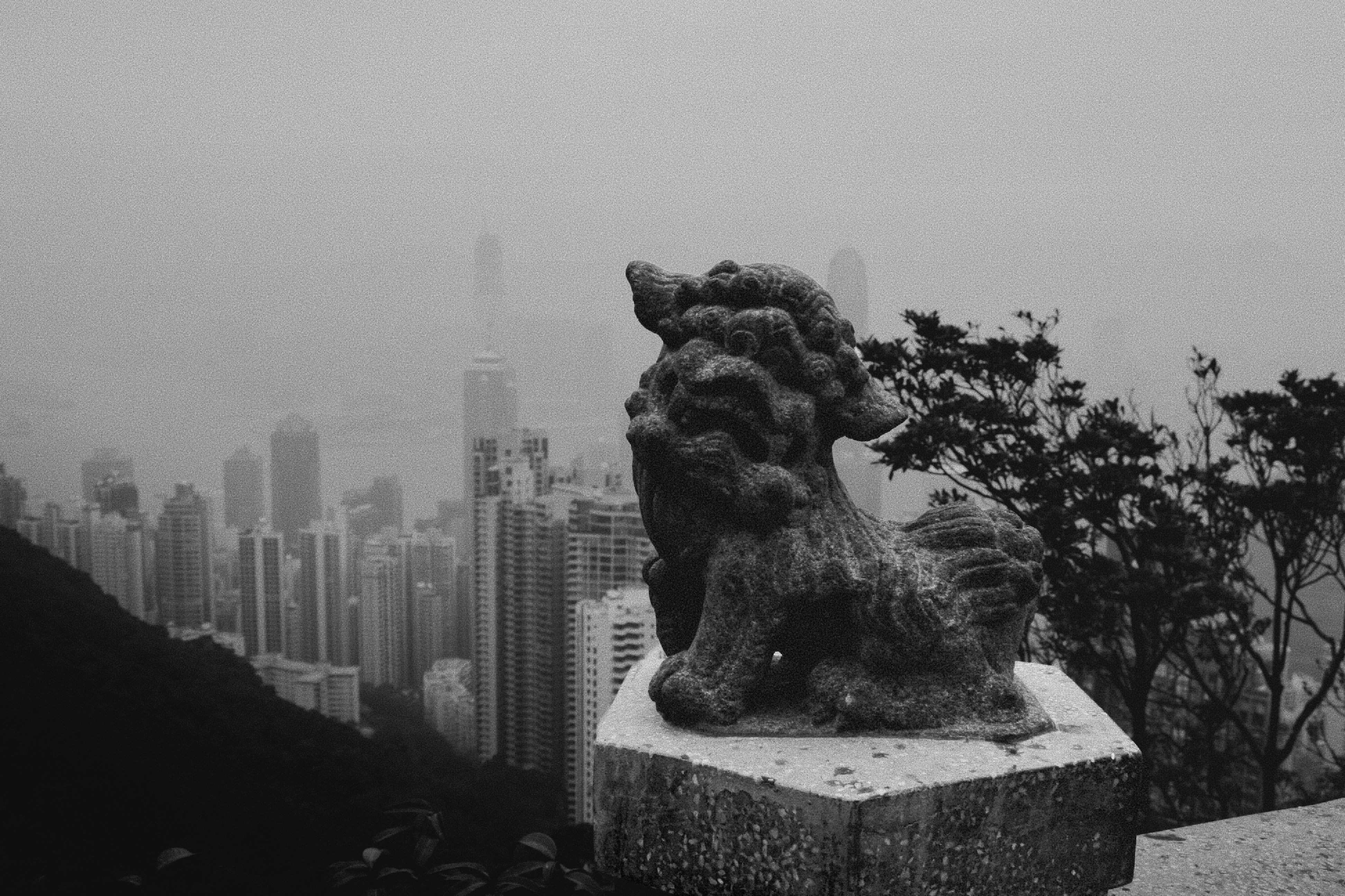 A black and white photo of a statue of a lion