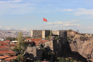 A castle with a flag on top of it