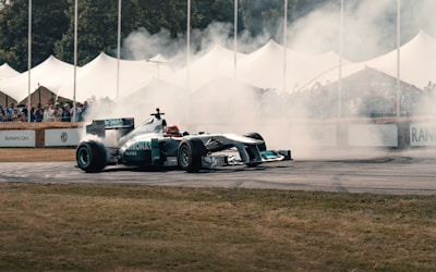 A man driving a race car on top of a race track