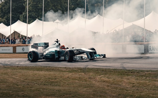 A man driving a race car on top of a race track