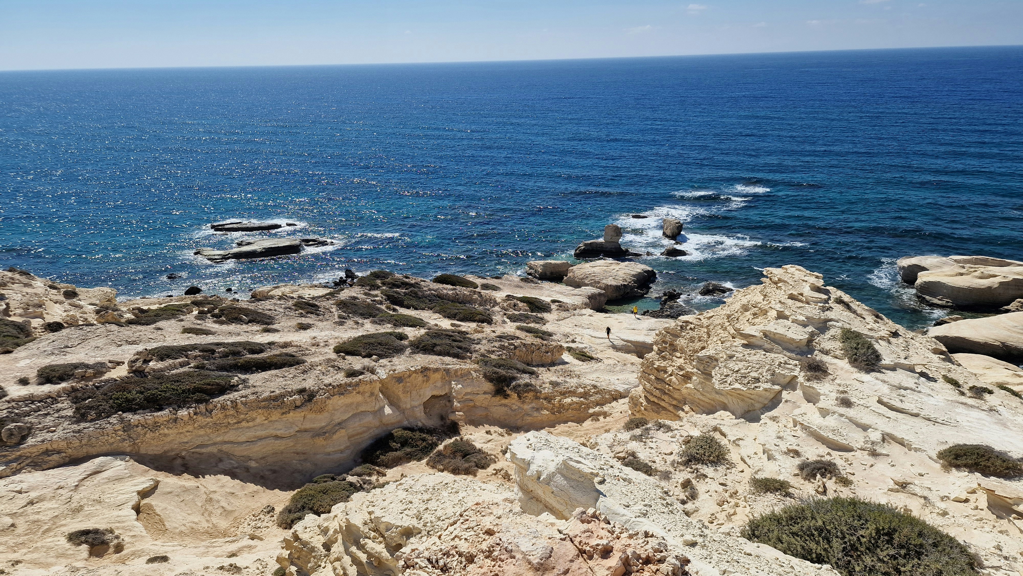 A view of the ocean from a rocky cliff