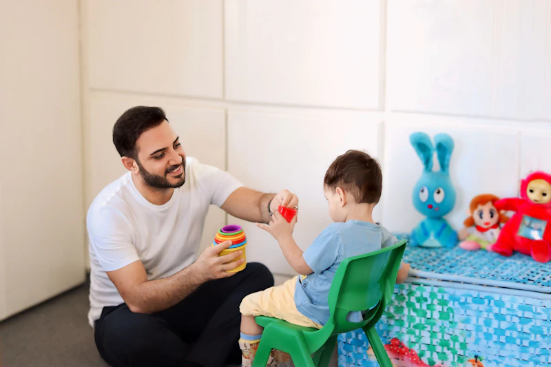 Therapist working with a child using oral-motor feeding tools