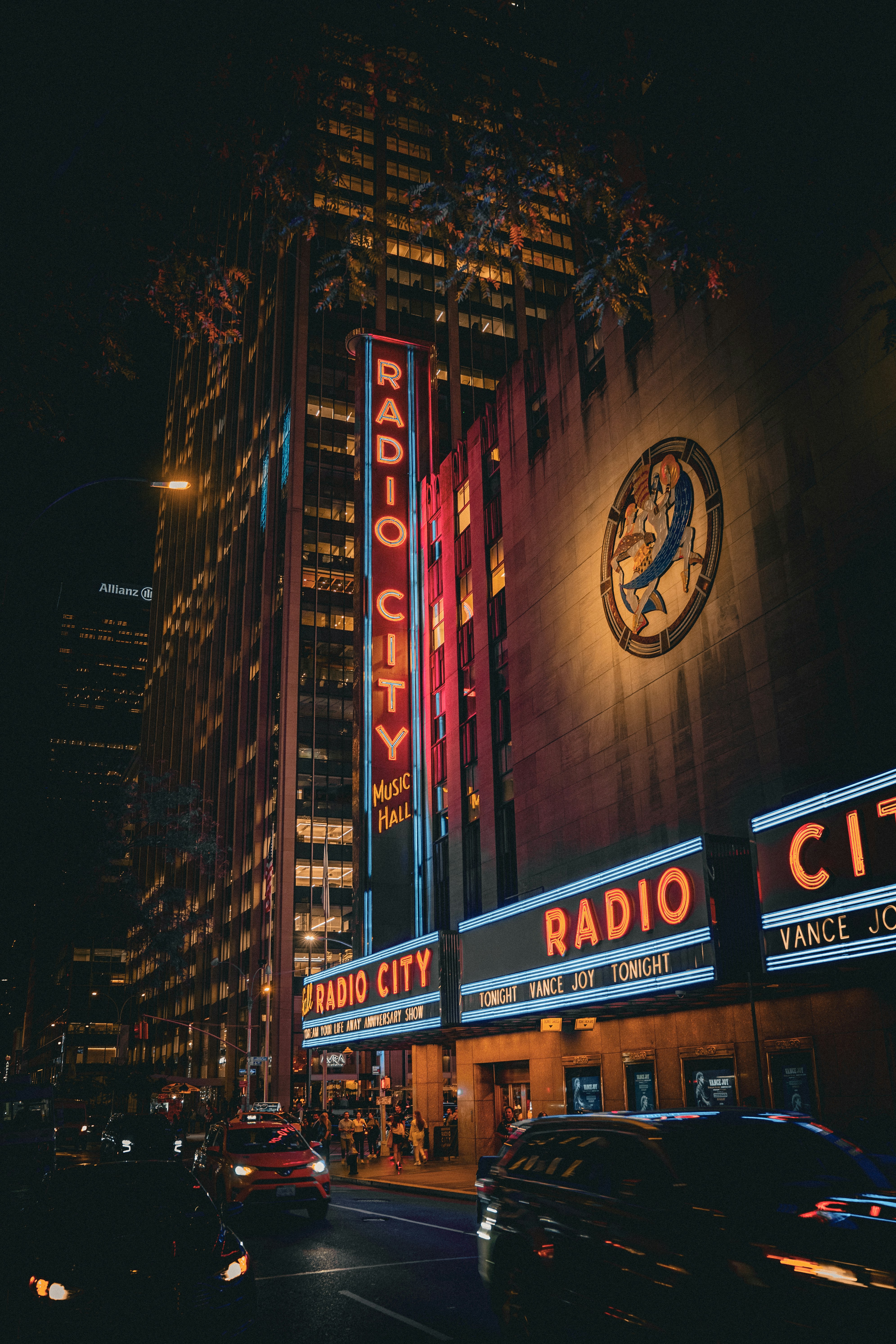 The radio city radio city building lit up at night