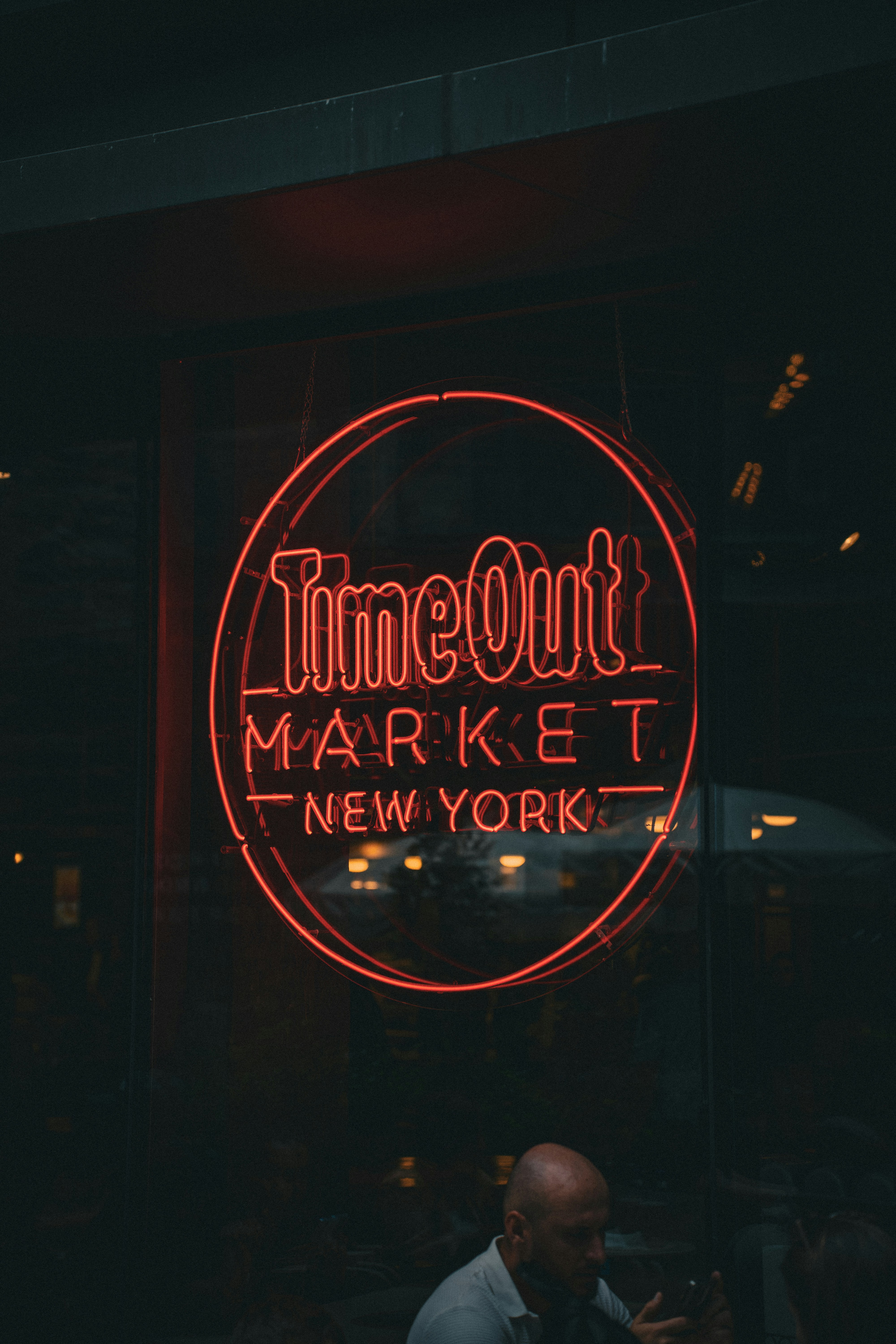 A neon sign that reads time out market new york