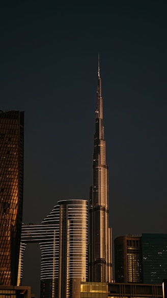 A very tall building towering over a city